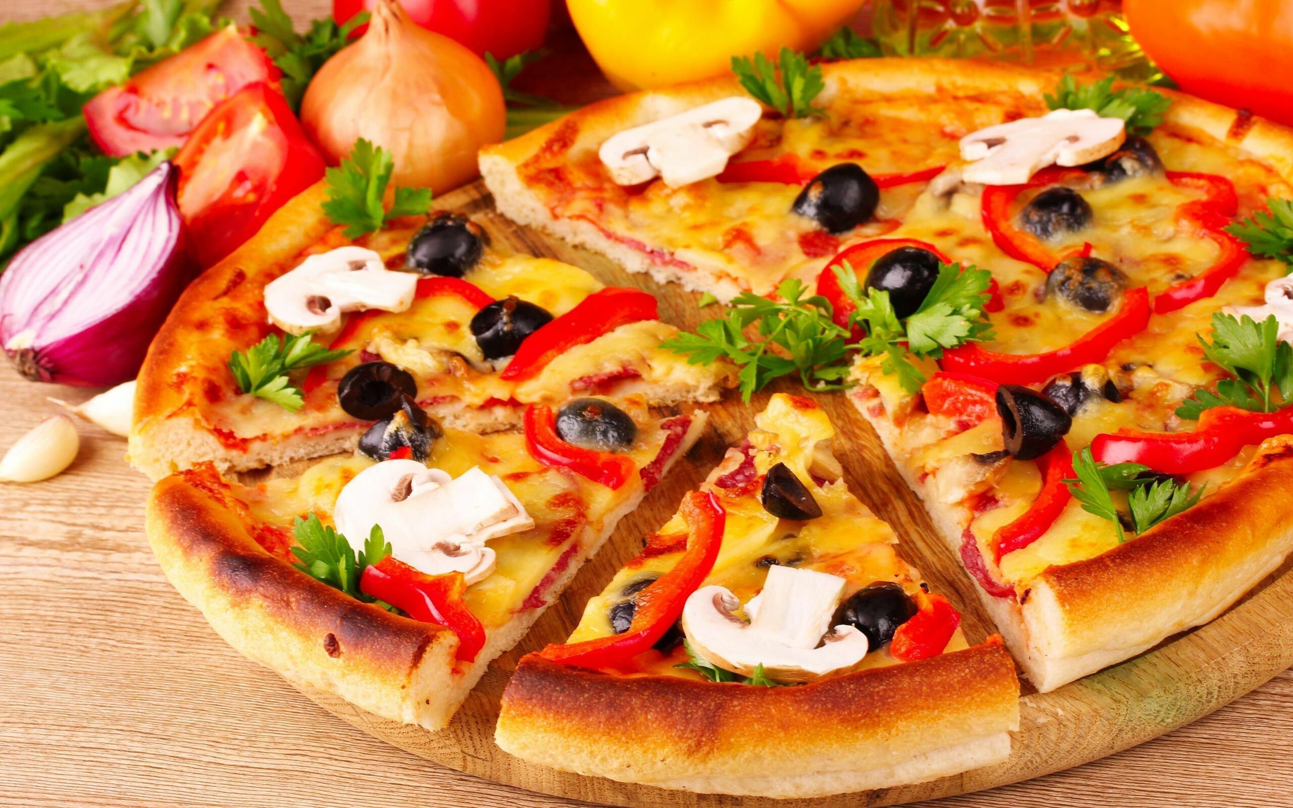 Pizza: A thinly rolled bread dough crust topped with various ingredients, Mushrooms. 2560x1600 HD Background.