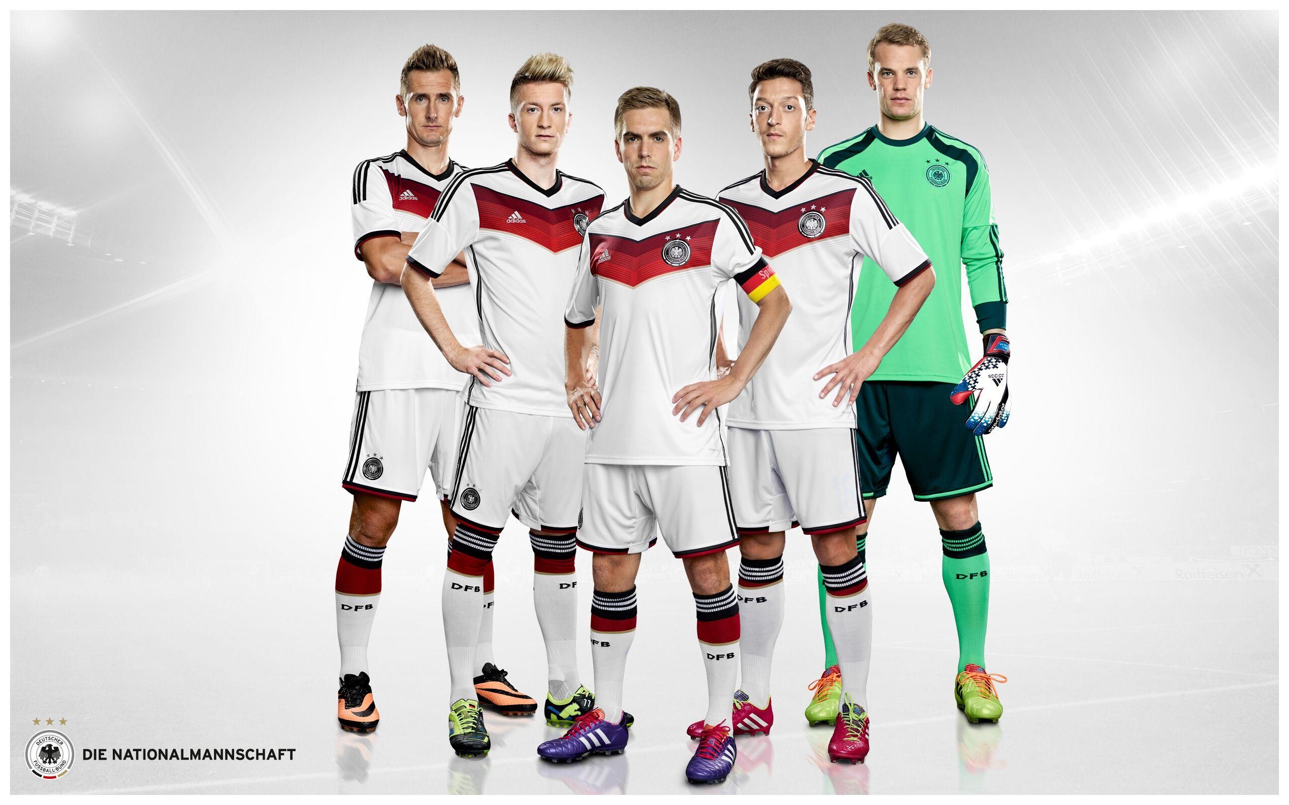 Germany National Football Team: Miroslav Klose, Marco Reus, Philipp Lahm, Mesut Ozil, Manuel Neuer, Official German soccer gear. 2560x1600 HD Wallpaper.