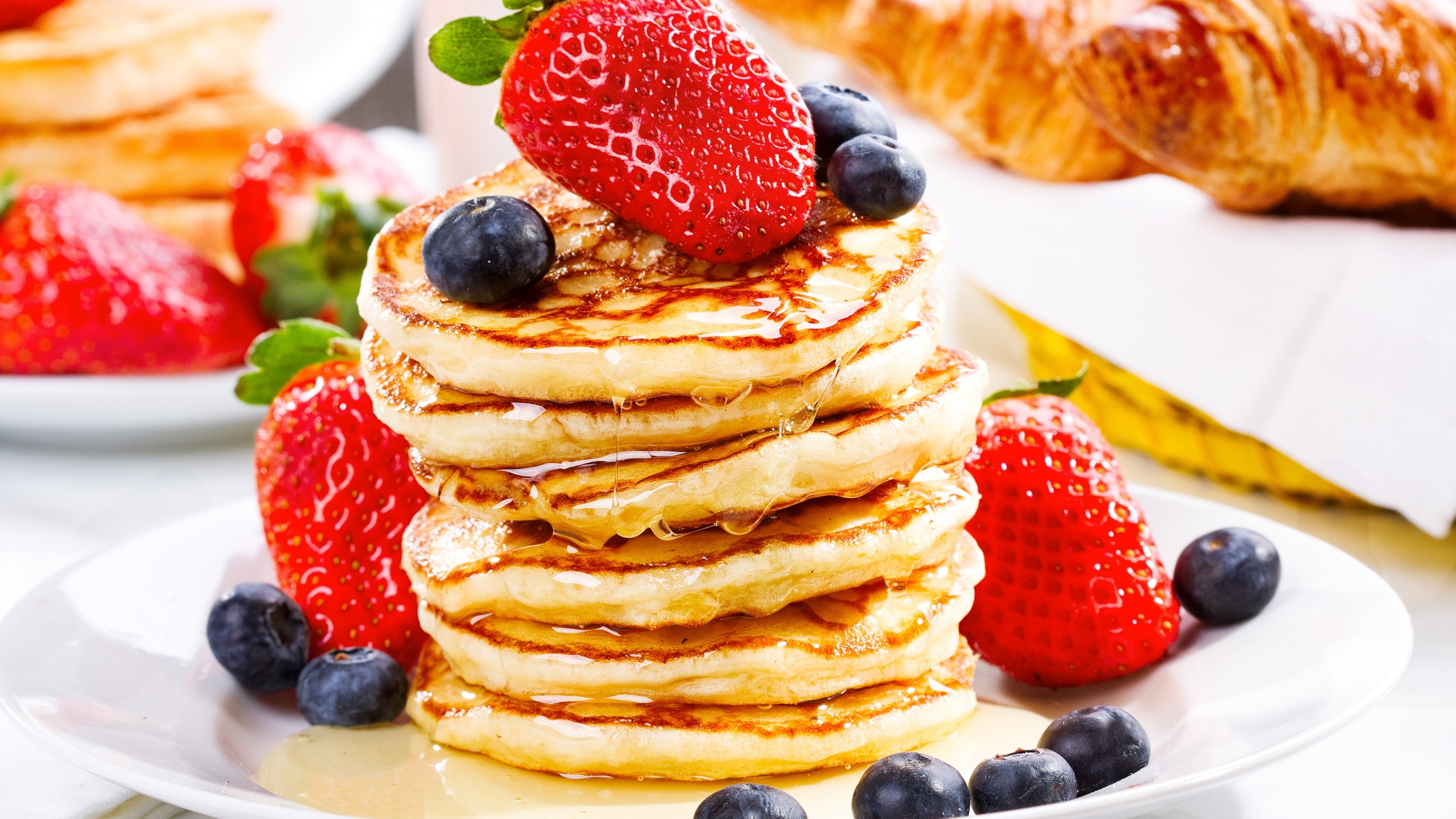 Pancake: A quick bread that uses baking powder. 3840x2160 4K Background.
