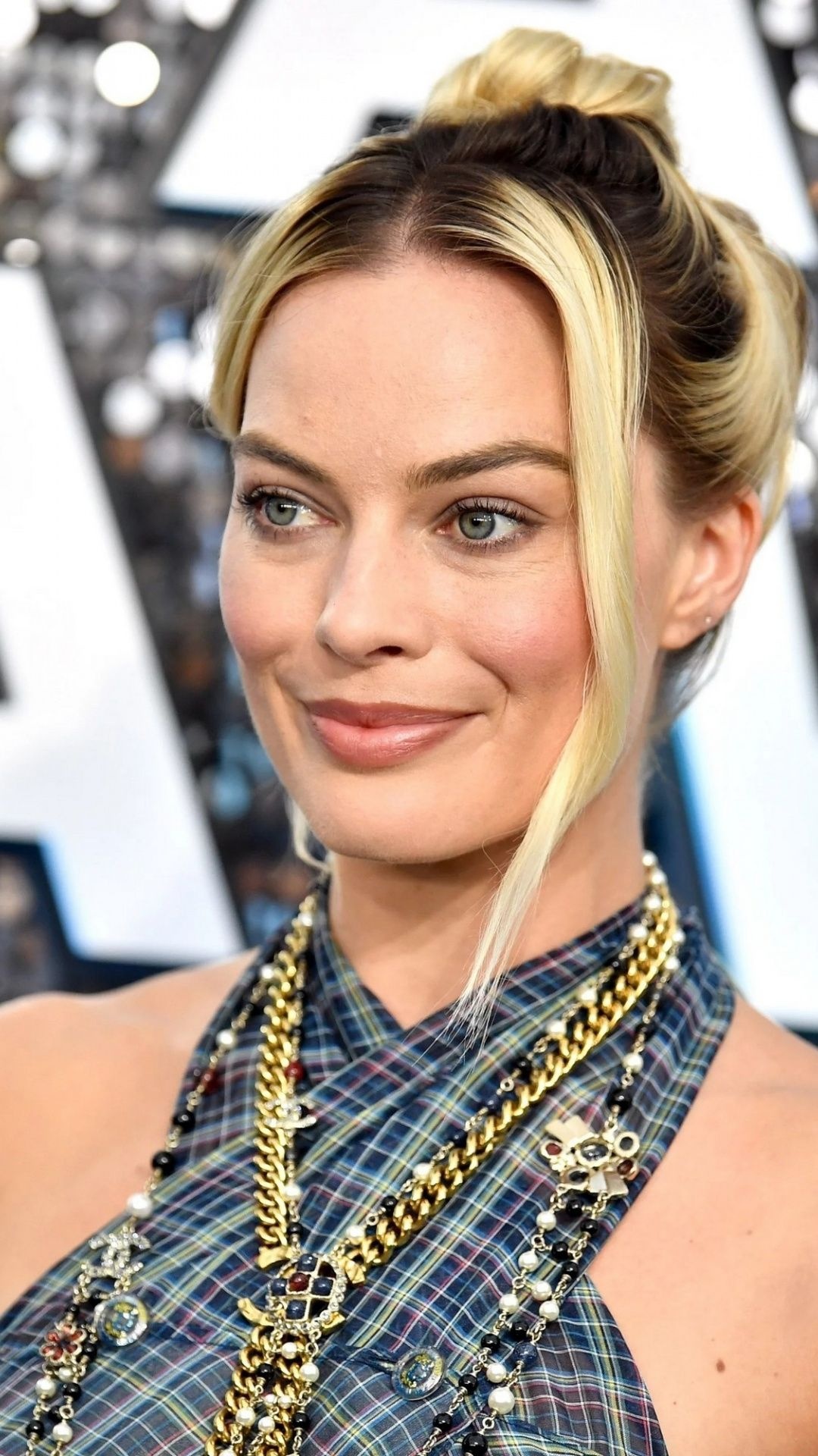 Margot Robbie: An Australian actress best known for her roles in 'The Wolf of Wall Street,' 'Suicide Squad' and 'I, Tonya'. 1080x1920 Full HD Wallpaper.
