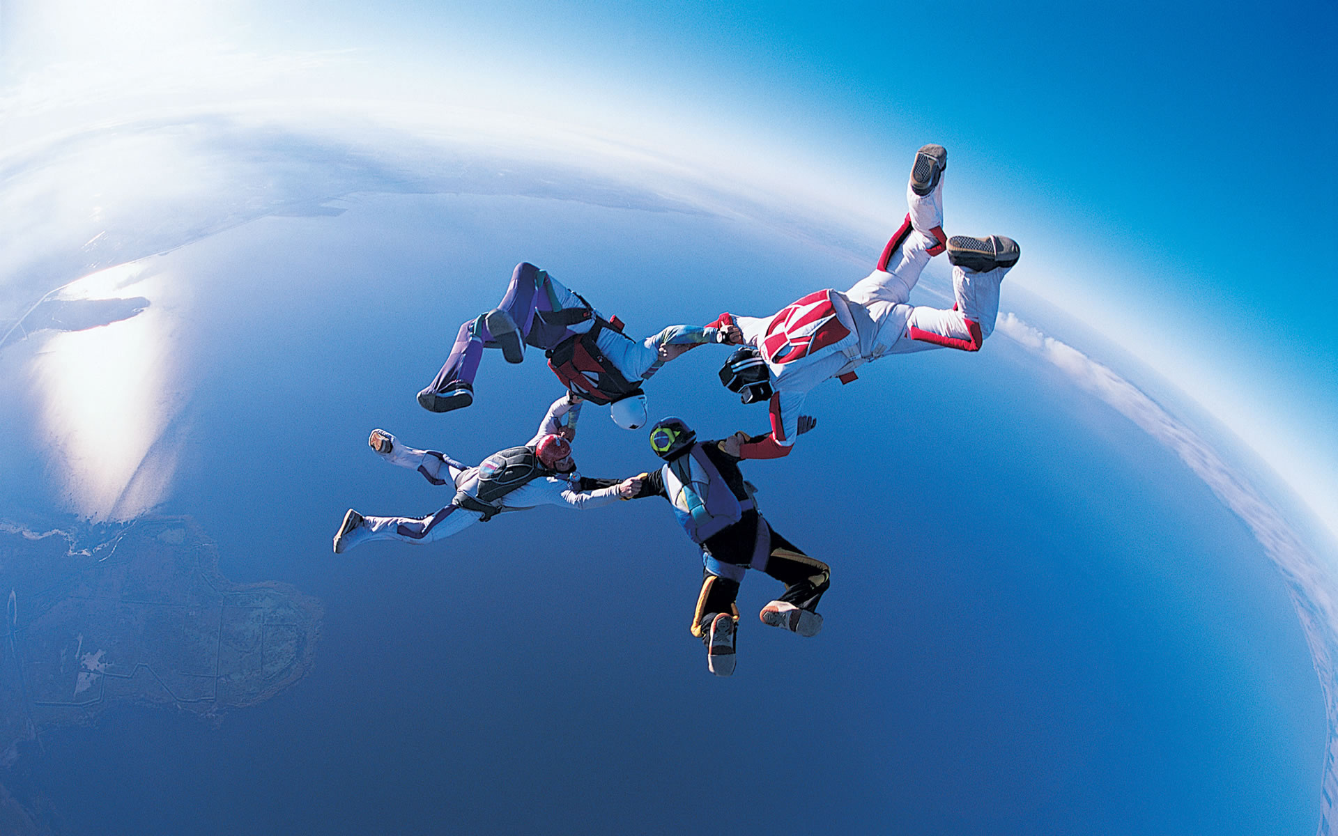 Air Sports: Four skydivers travel from the edge of space, High altitude view of the Earth. 1920x1200 HD Background.