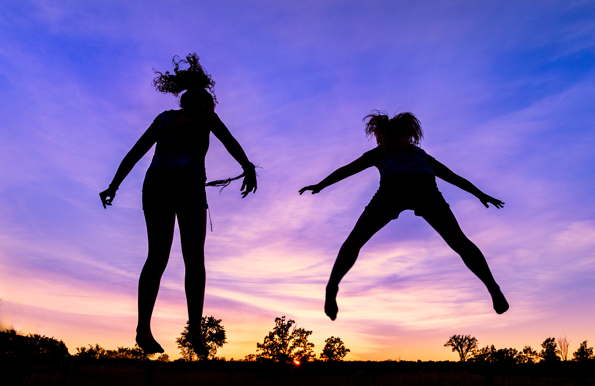 Trampolining: Jumping kids in the sunset, Recreational acrobatics sport discipline. 2050x1340 HD Wallpaper.