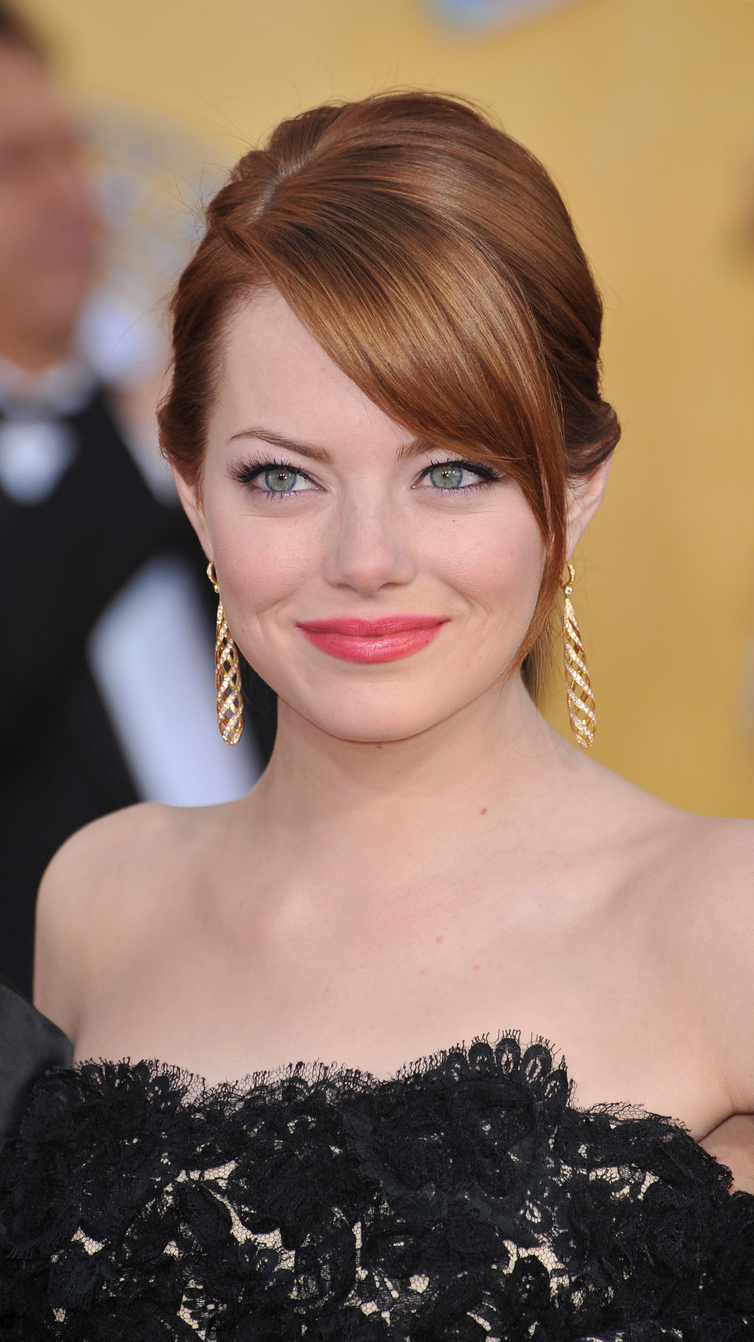 Emma Stone movies, Mobile wallpapers, High-resolution images, Celebrity charm, 1080x1920 Full HD Phone