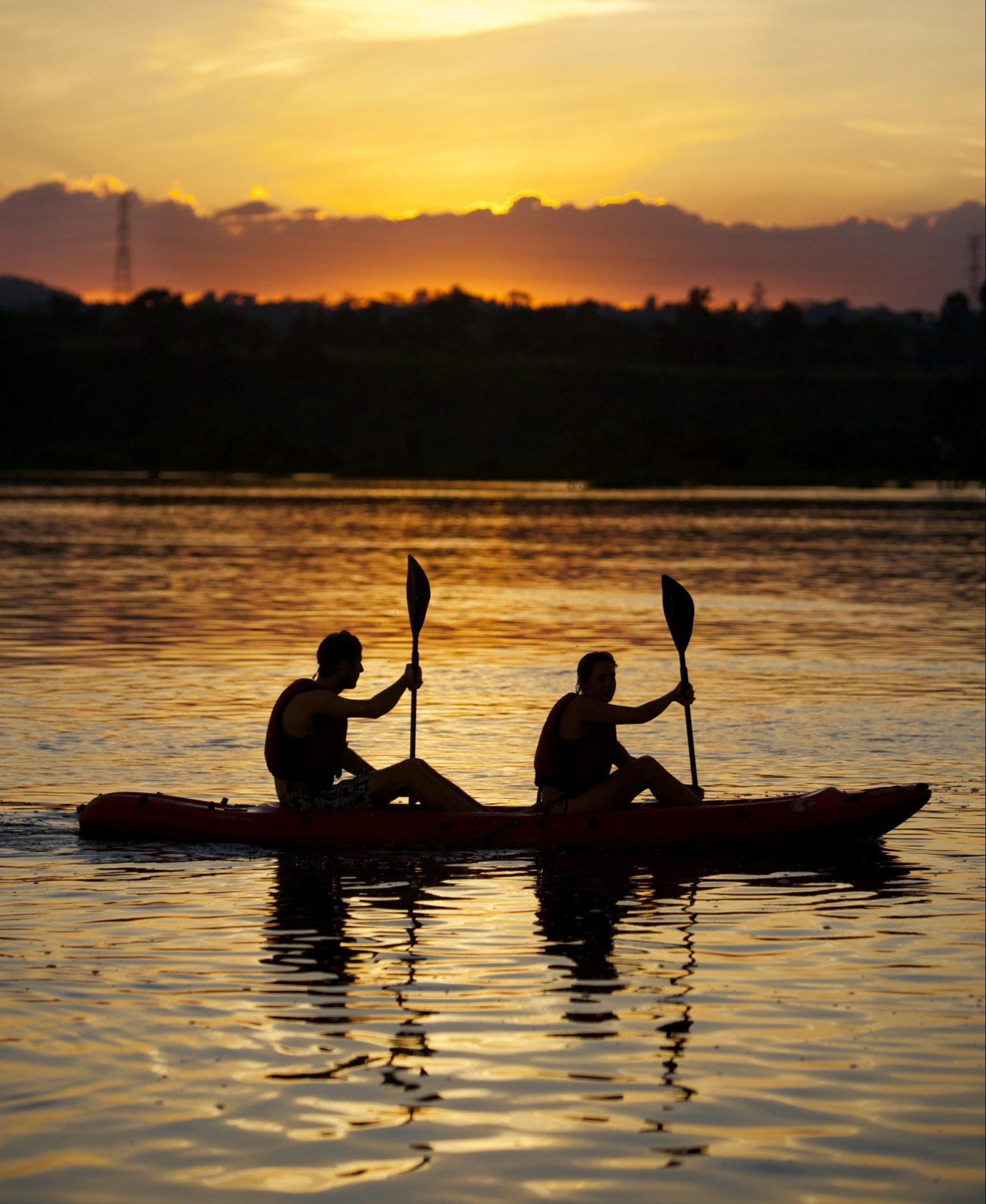 Kayaking: A double-seat kayak is used by two men for recreational purposes. 1710x2090 HD Wallpaper.