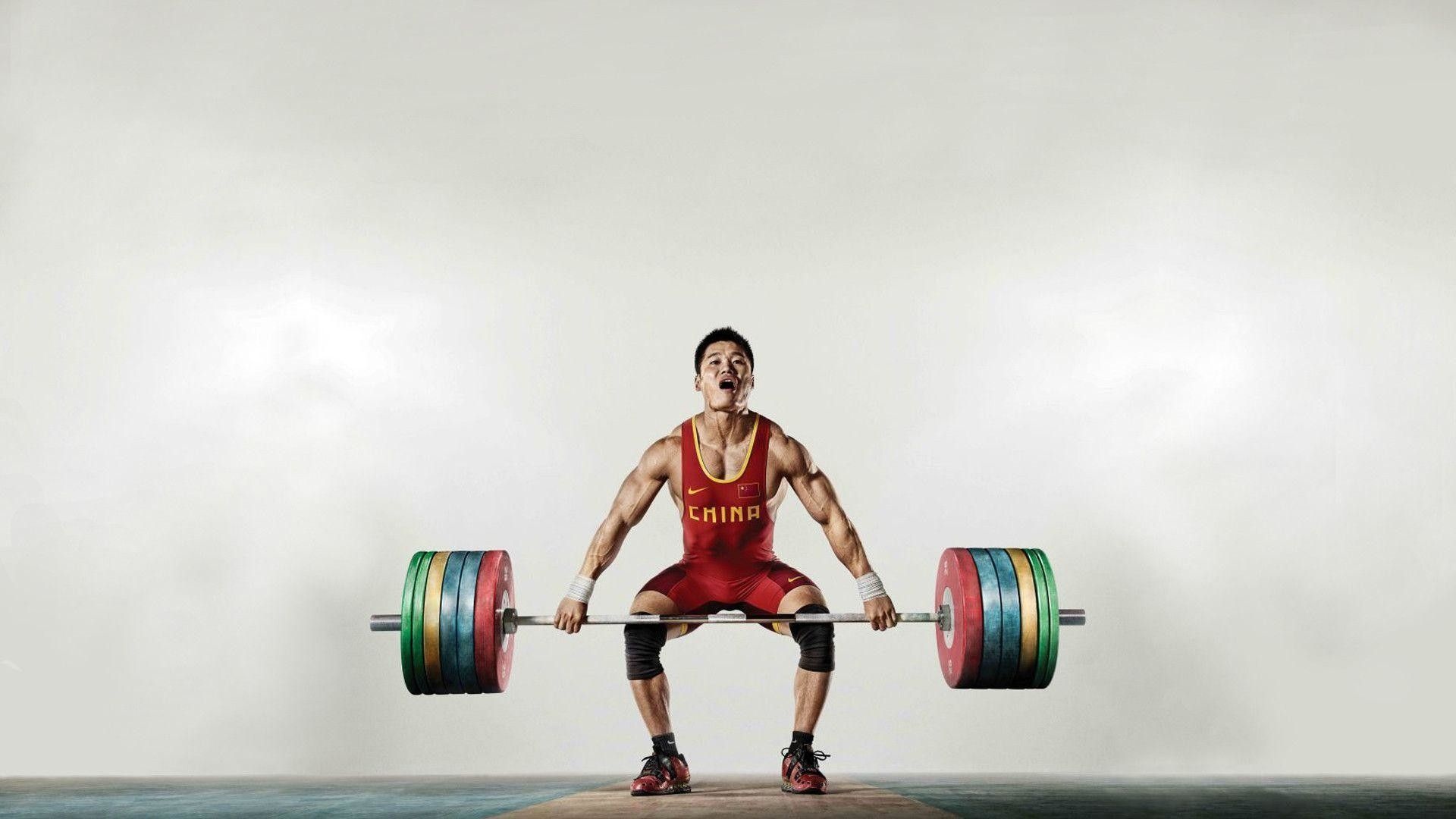 Weightlifting: Chinese weightlifter, Nike, A deadlift suit, Lifting a barbell loaded with weight plates. 1920x1080 Full HD Background.