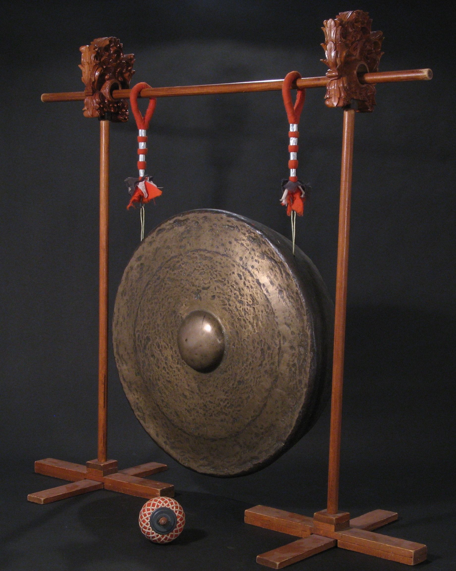 Gong: Bali’s traditional musical instruments, Circular metal plate producing sounds of definite pitch. 1840x2310 HD Background.