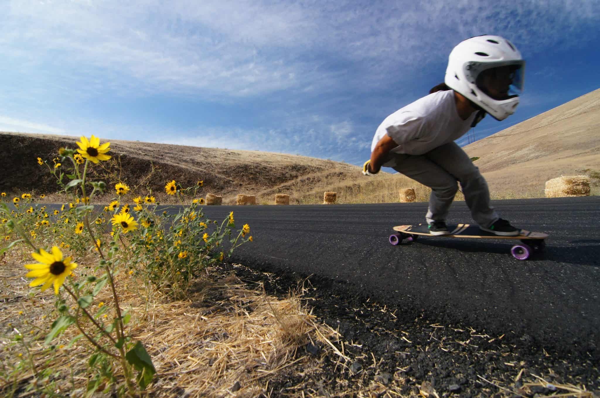 Longboarding: The rider uses Reverse Kingpin Trucks longboard to downhill, Extreme sport. 2050x1370 HD Background.