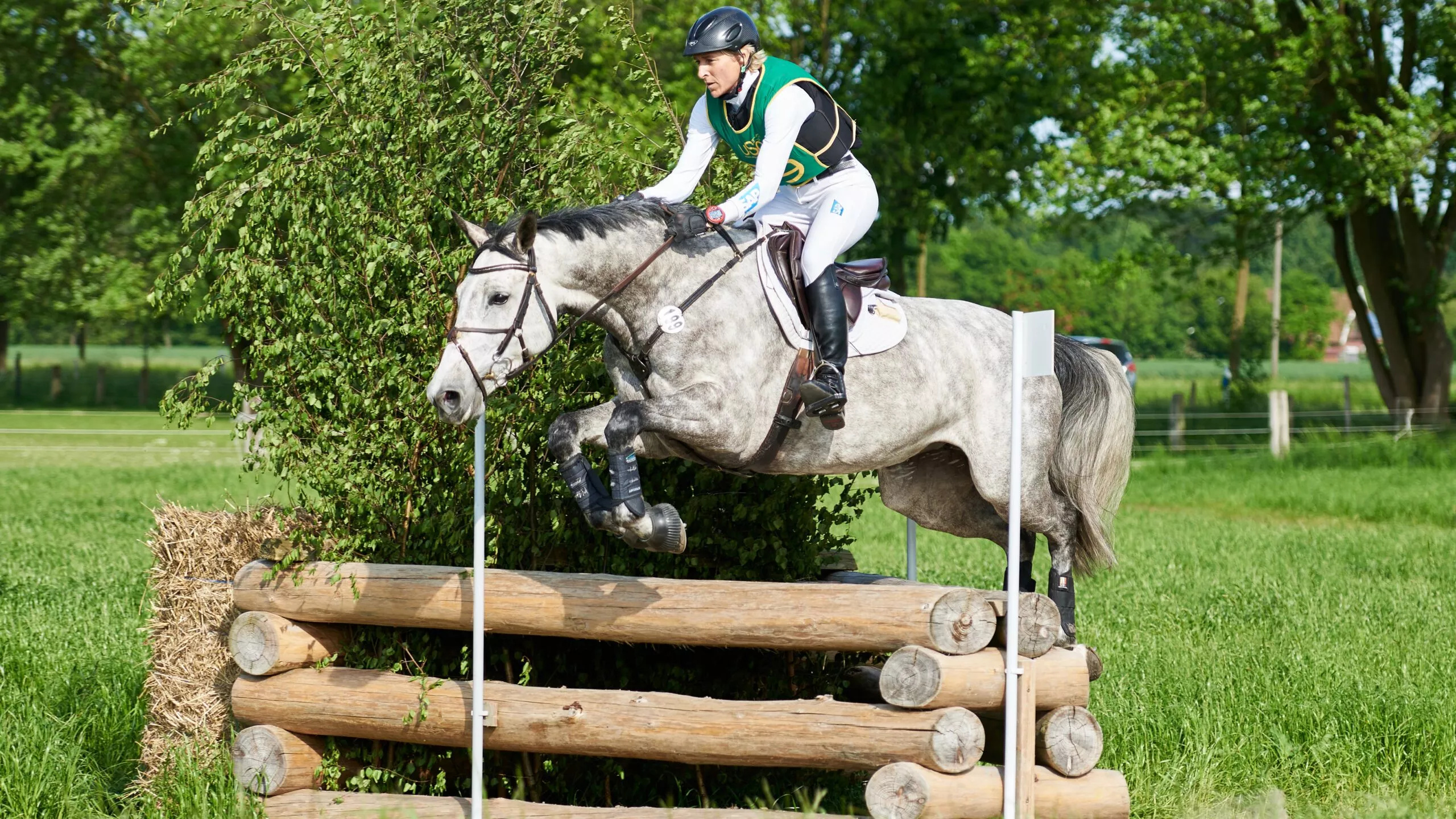 Eventing: Cross-country jumping with horses, A test for endurance, skill and agility. 2560x1440 HD Wallpaper.