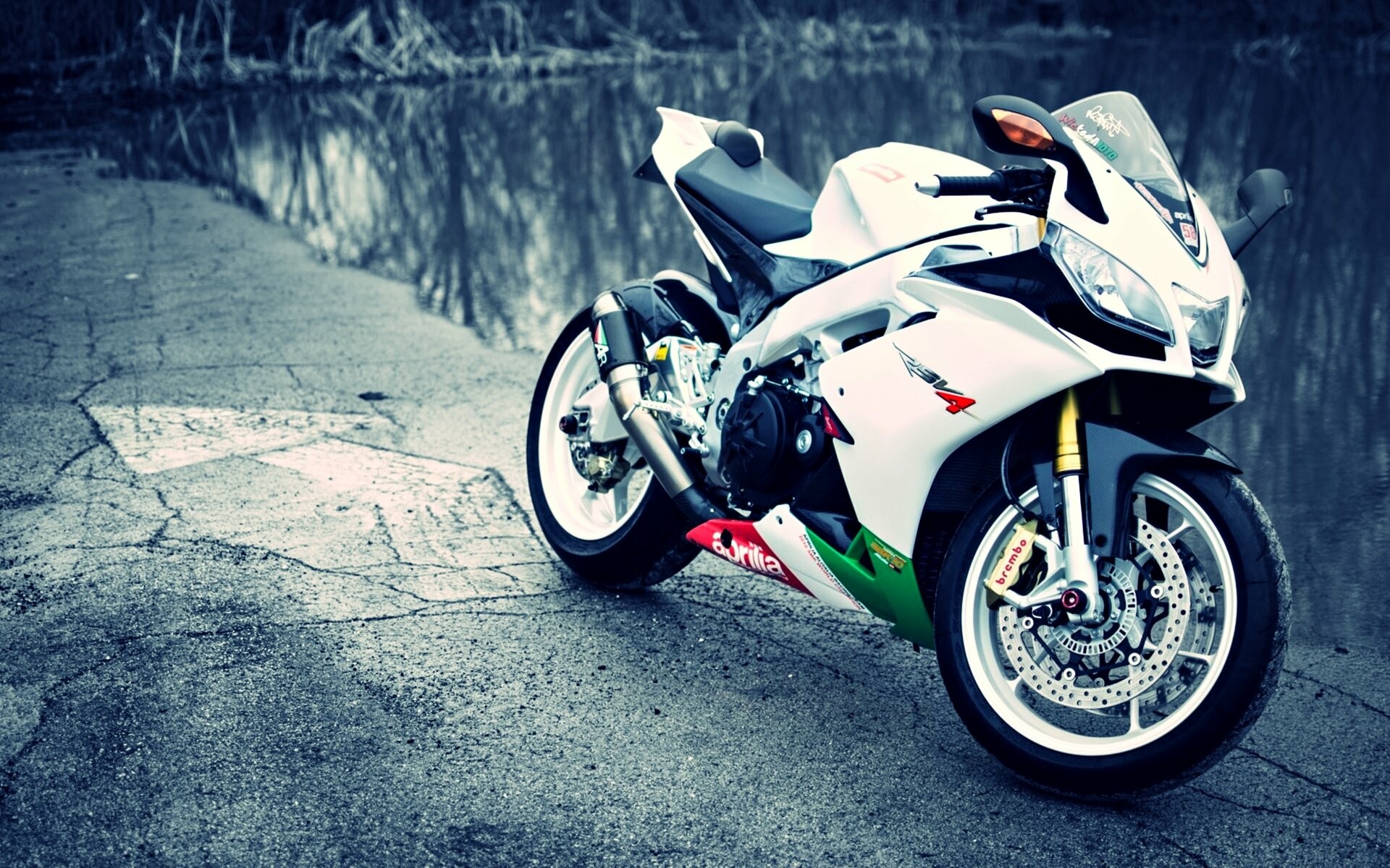 Aprilia: RSV4, Powered by a 65-degree 999.6 cc V-4 engine, the company's first production four-cylinder engine. 1920x1200 HD Background.
