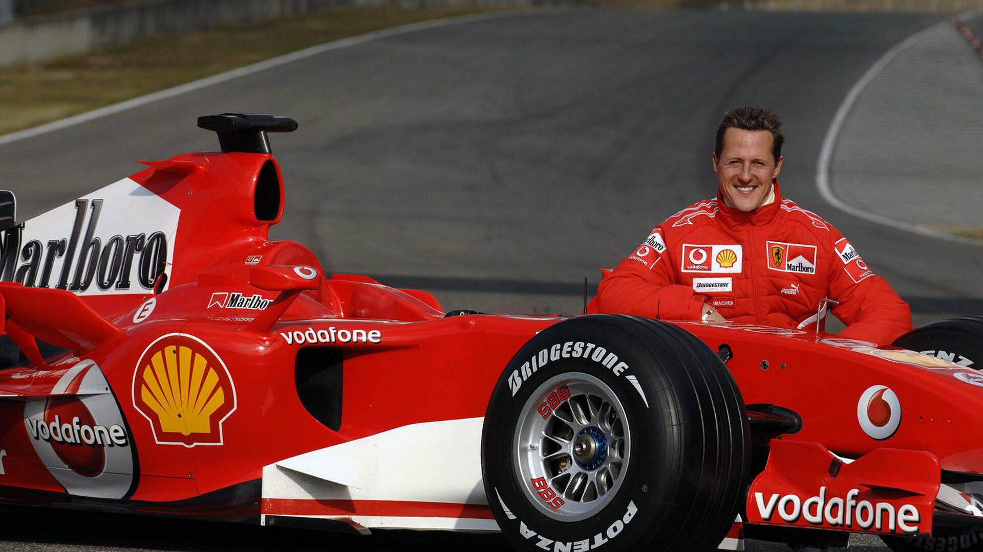 Michael Schumacher: He joined Scuderia Ferrari In 1996 and finished third in the Drivers' Championship in that year. 1920x1080 Full HD Background.
