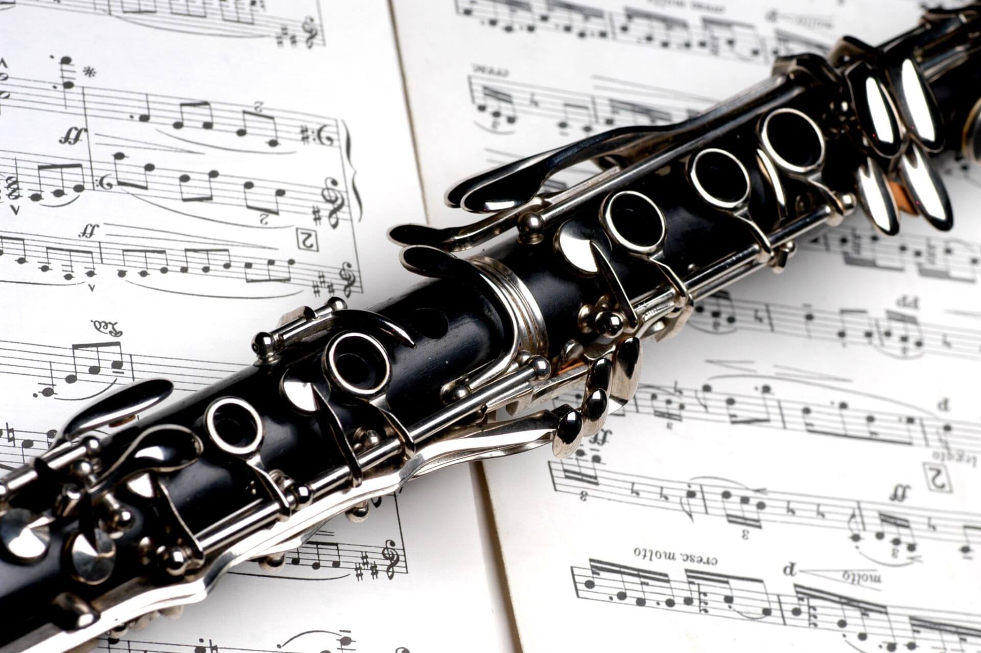 Clarinet: Changing notes by covering tone holes, Usage in most major ensembles, Black and made of plastic. 1920x1280 HD Background.