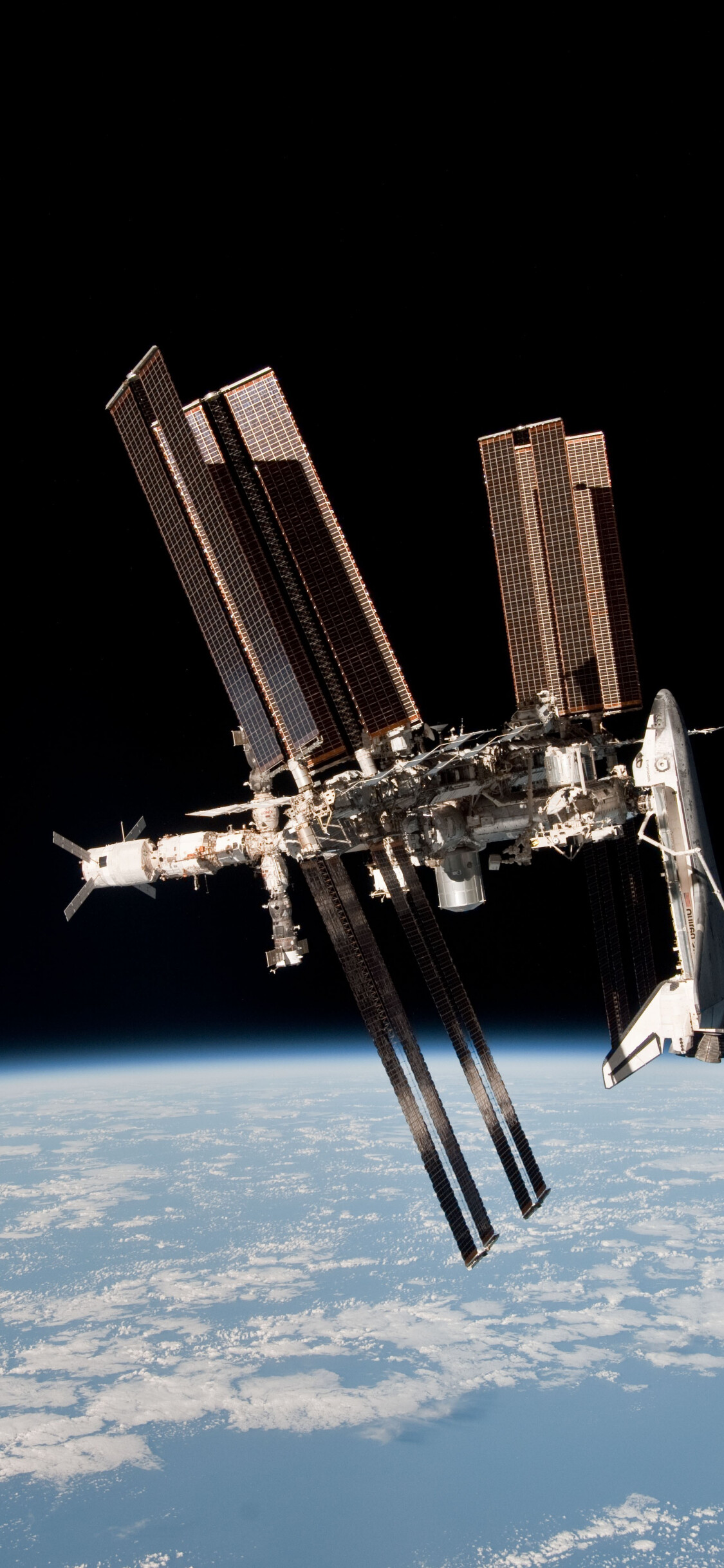 ISS: A habitable artificial satellite in low Earth orbit, Space Shuttle. 1130x2440 HD Wallpaper.