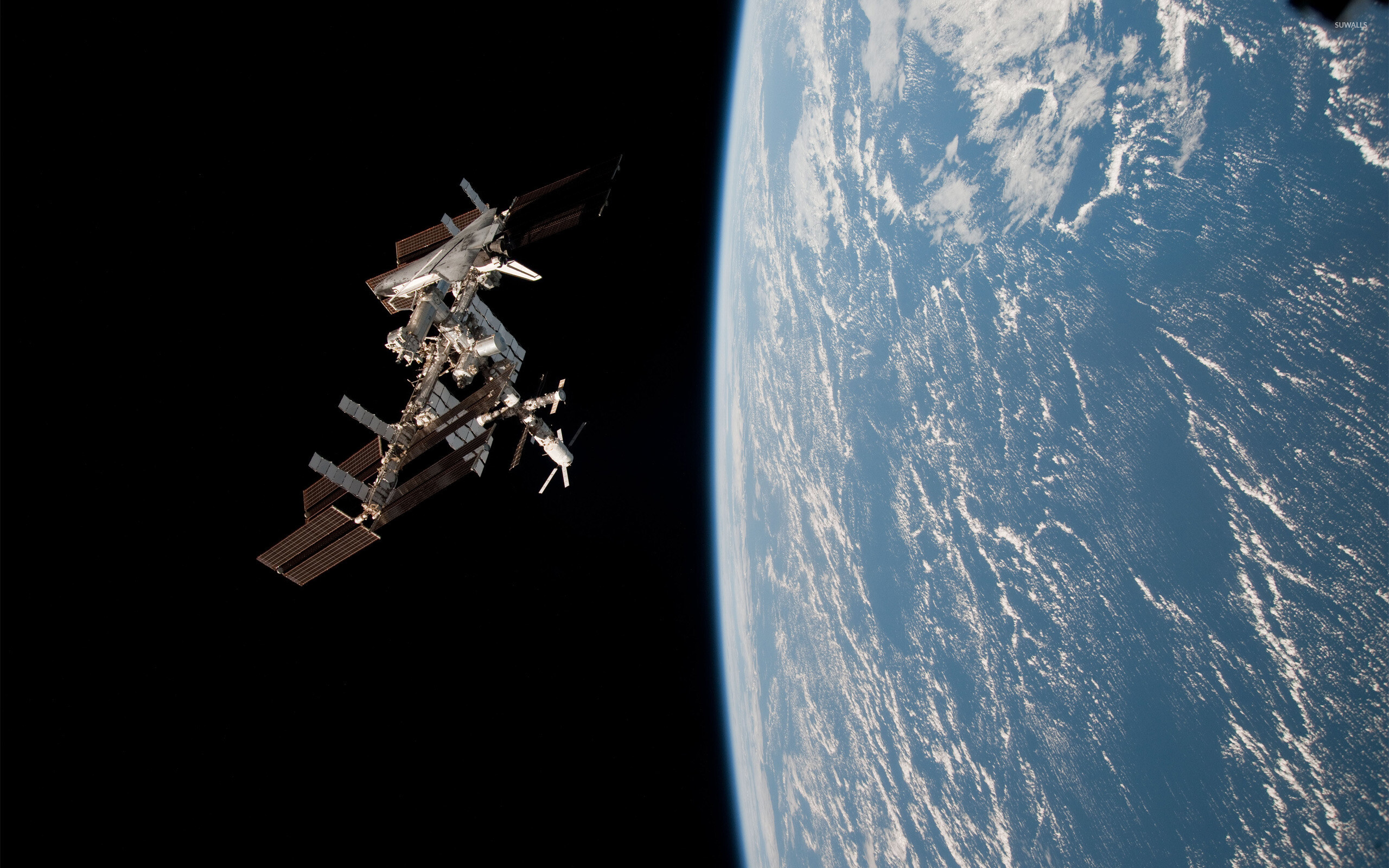 International Space Station: The project involves five space agencies: NASA, Roscosmos, JAXA, ESA, and CSA. 2560x1600 HD Wallpaper.