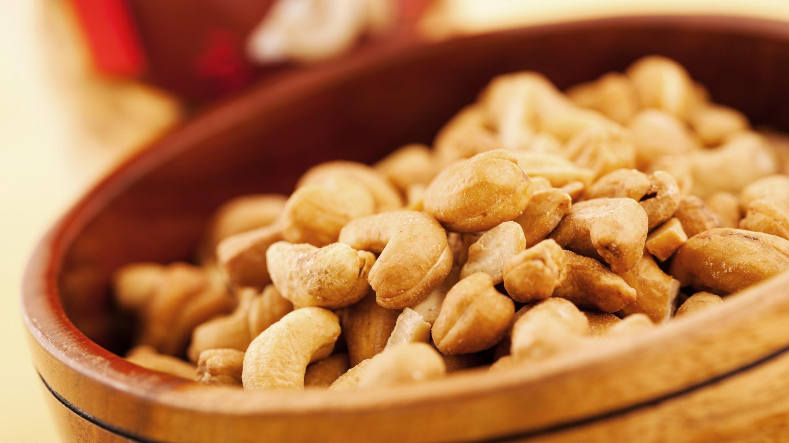 Cashew Nuts: Rich in oil and distinctively flavored, A premium-quality protein-rich snack food. 2560x1440 HD Wallpaper.
