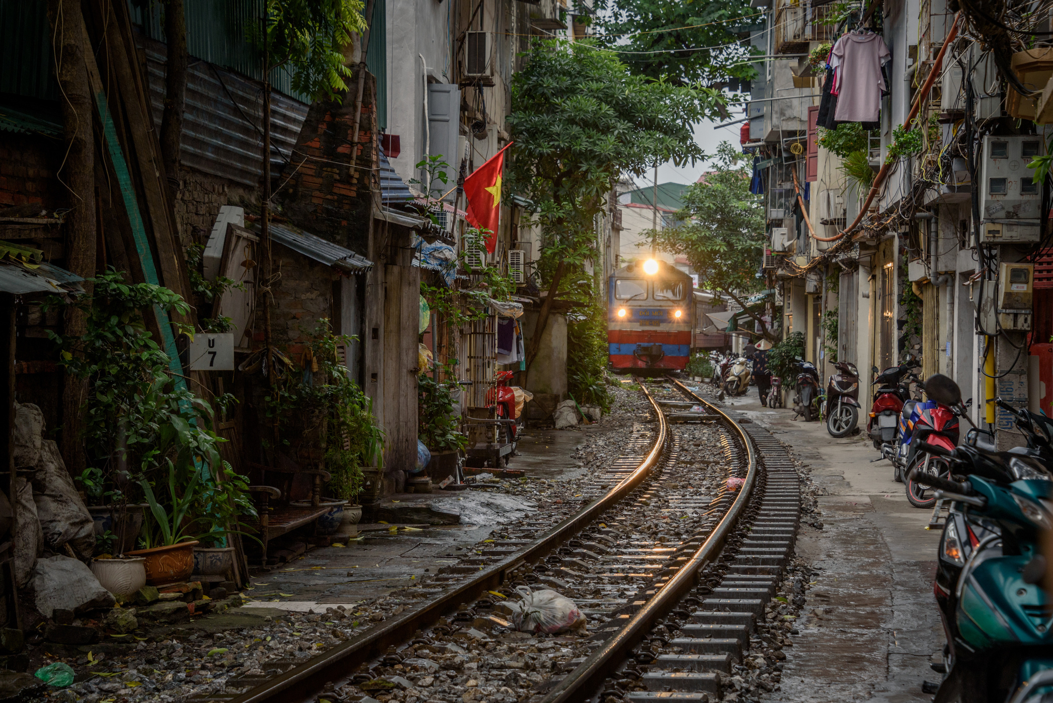 Hanoi city life, Famous train street, Overcrowding issues, Vibrant atmosphere, 2120x1420 HD Desktop