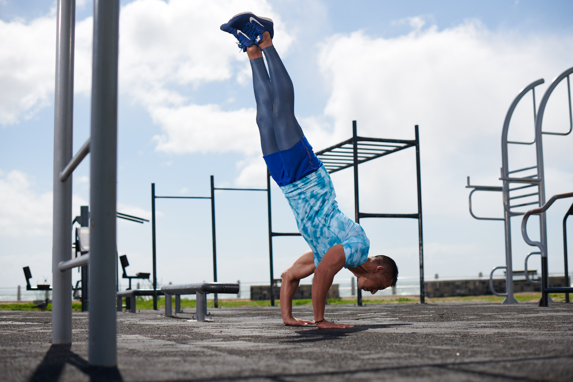 Calisthenics: Handstand performed by a professional gymnast, Outdoor exercise. 2200x1470 HD Background.