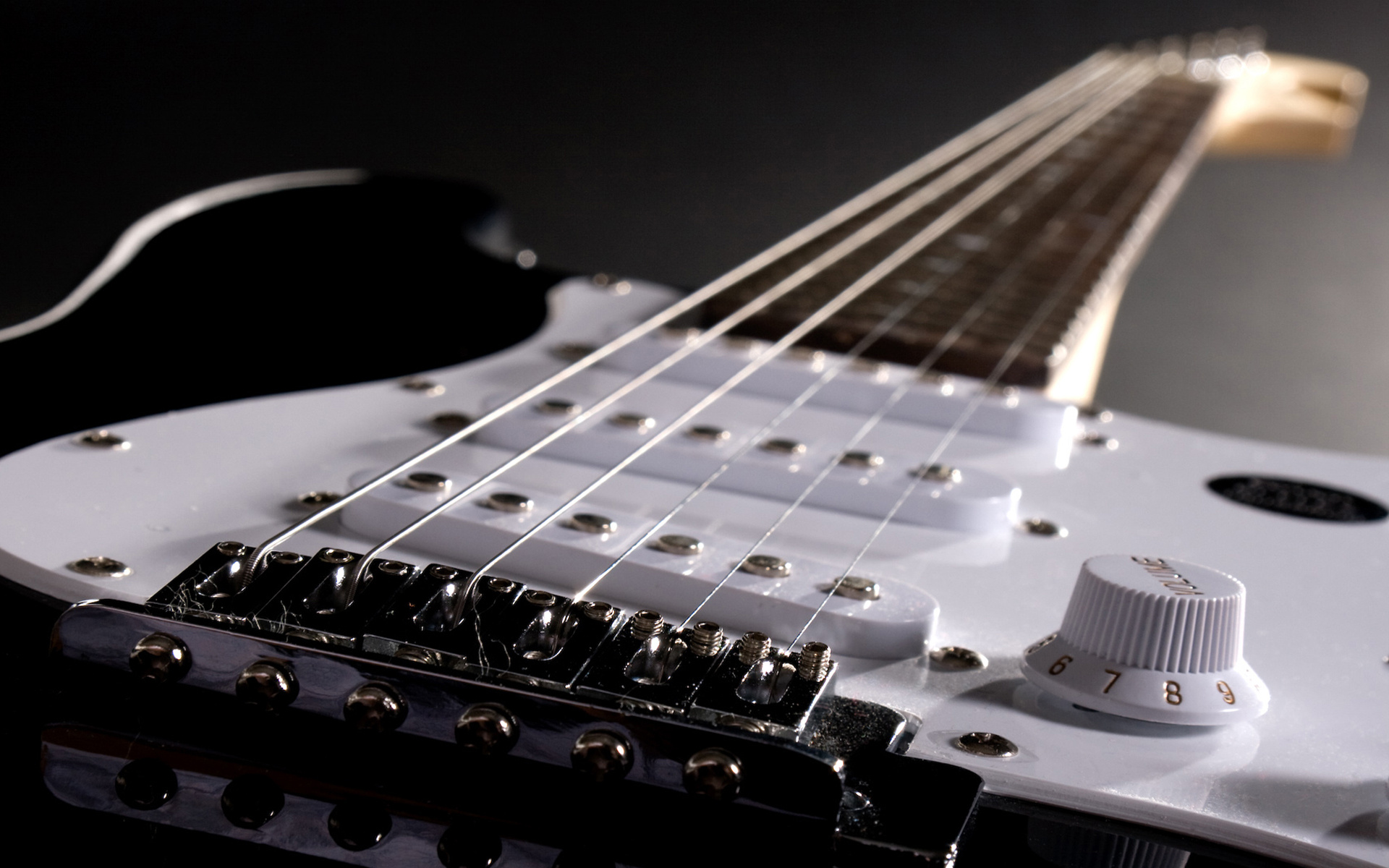 Guitar: A musical instrument having a flat-backed rounded body that narrows in the middle. 1920x1200 HD Background.
