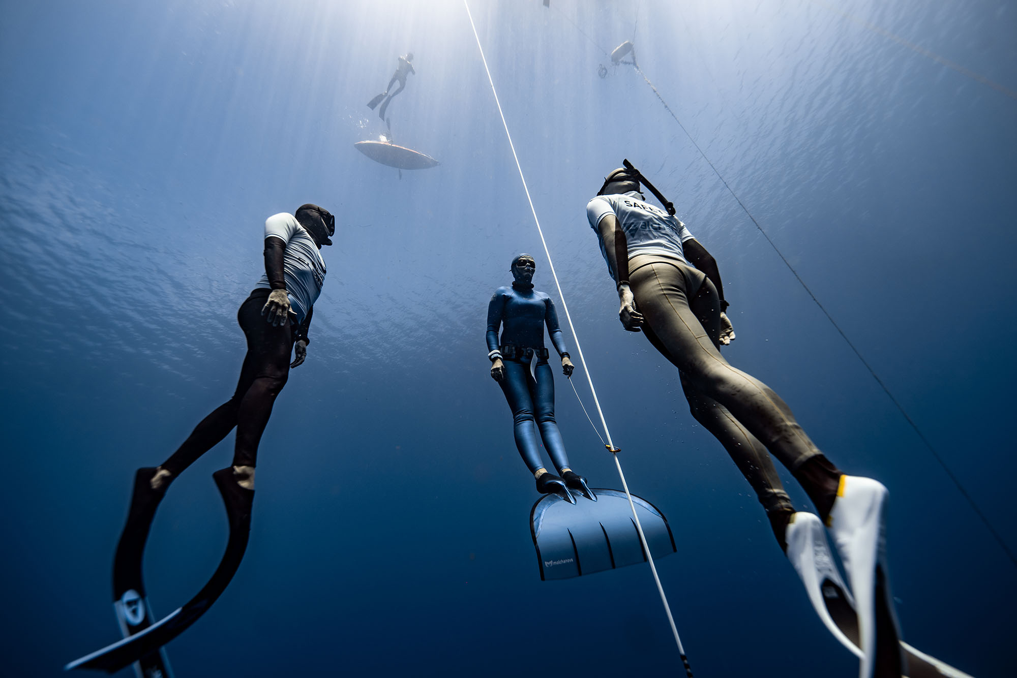 Freediving: A group of amateurs during a skin diving training session. 2000x1340 HD Background.