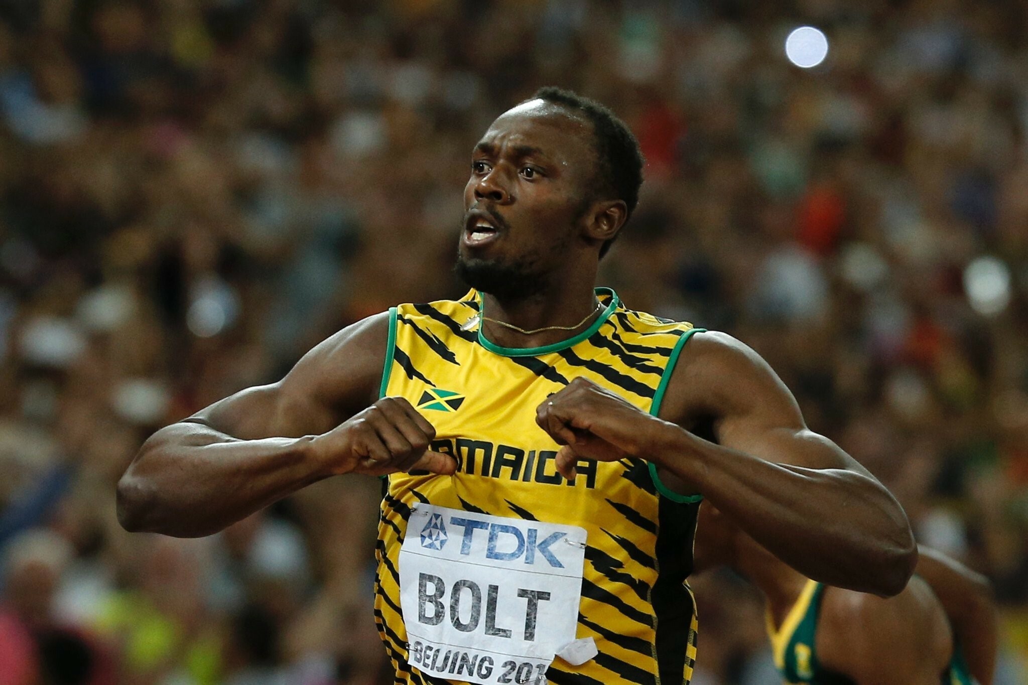 Usain Bolt: His most successful event is the 200 m, with three Olympic and four World titles. 2050x1370 HD Background.