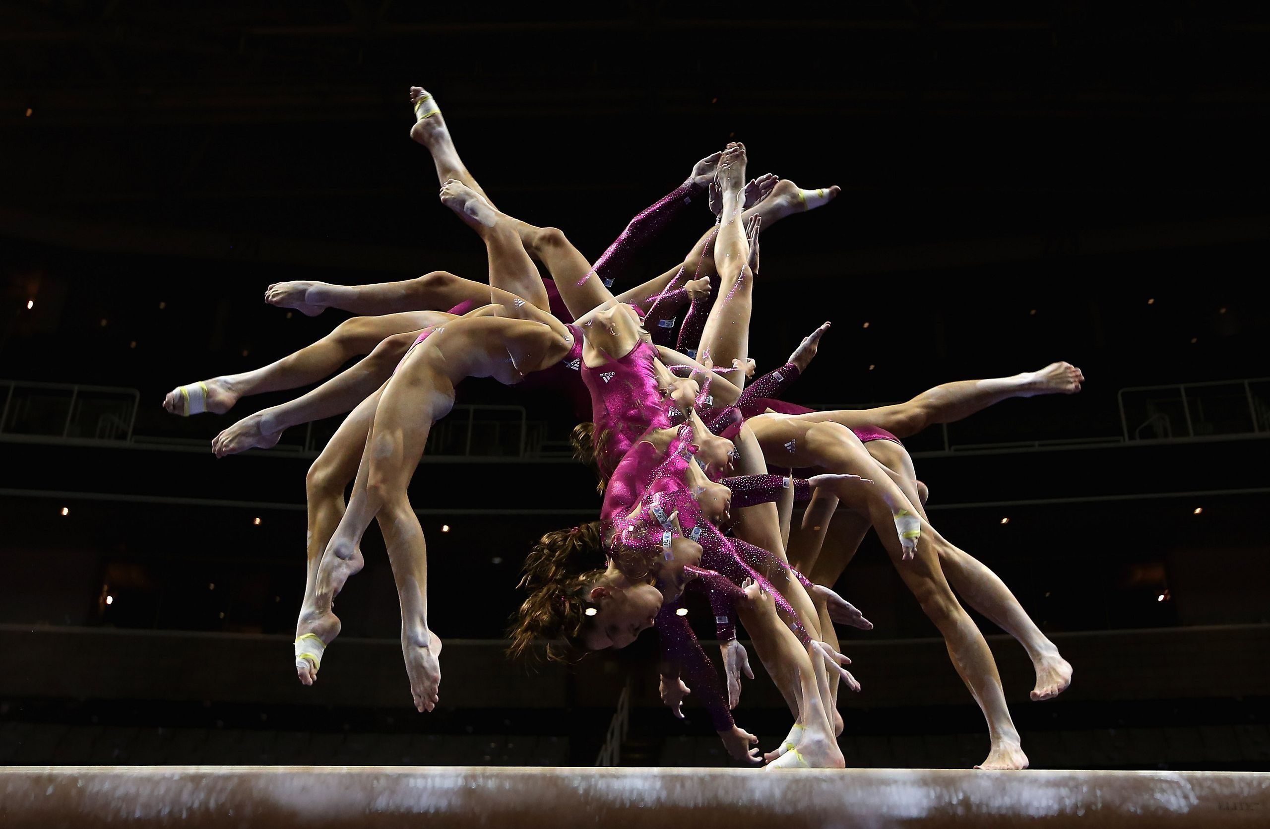 Acrobatic Gymnastics: The balance beam event, A style of artistic choreography with the use of a rectangular apparatus. 2560x1680 HD Background.