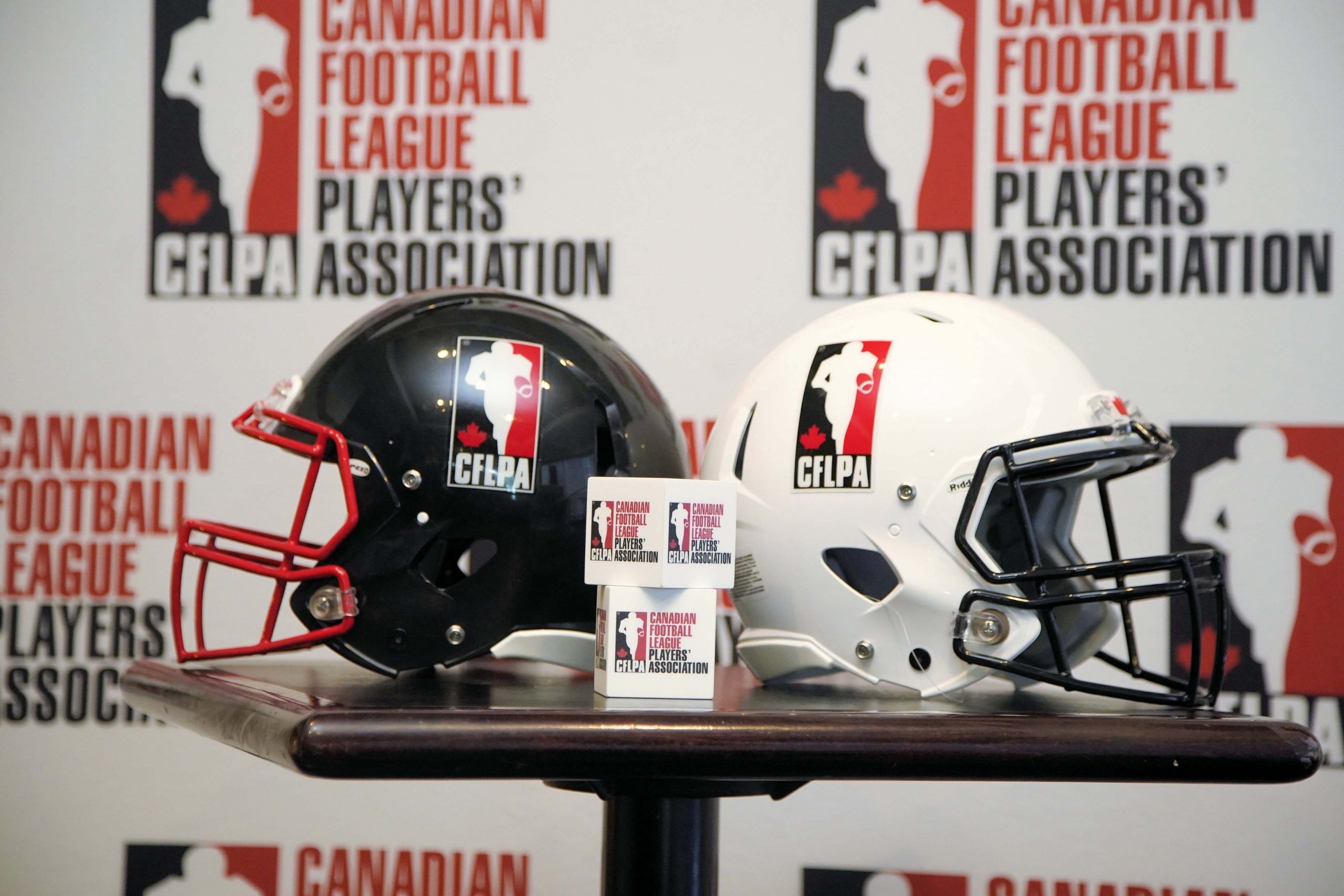 Canadian Football: The Canadian Football League Players' Association standard protective helmets, CFLPA. 2560x1710 HD Background.
