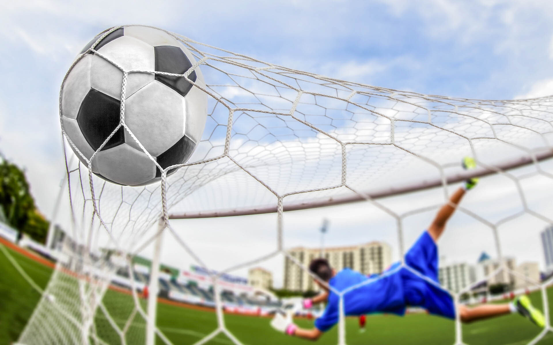 Goal (Sports): Soccer player catching the ball, Spectacular jumps, A football field. 1920x1200 HD Wallpaper.