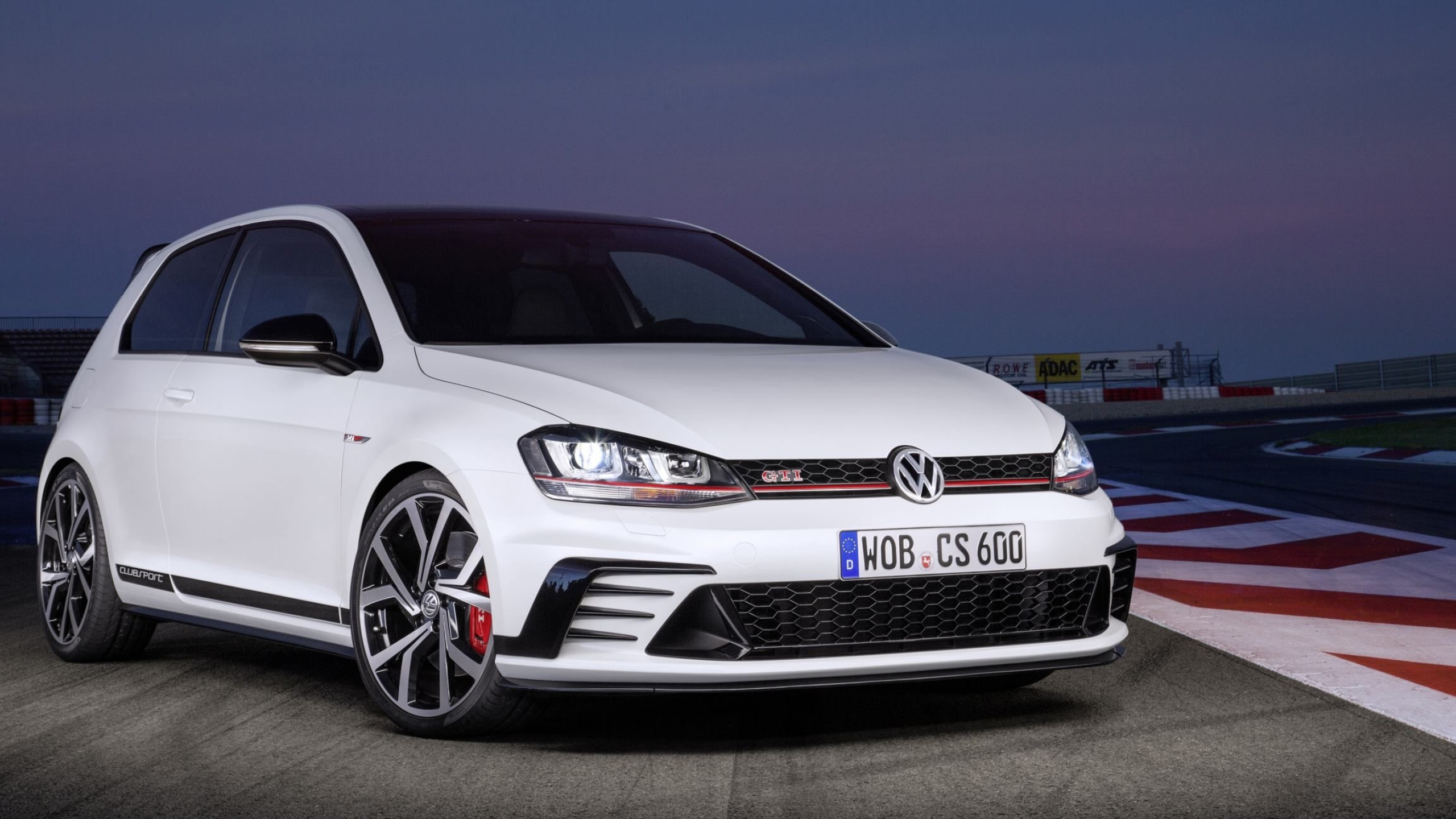 Golf GTI: A high-performance gasoline model powered by a 2.0-litre turbocharged direct-injection petrol engine. 2560x1440 HD Wallpaper.