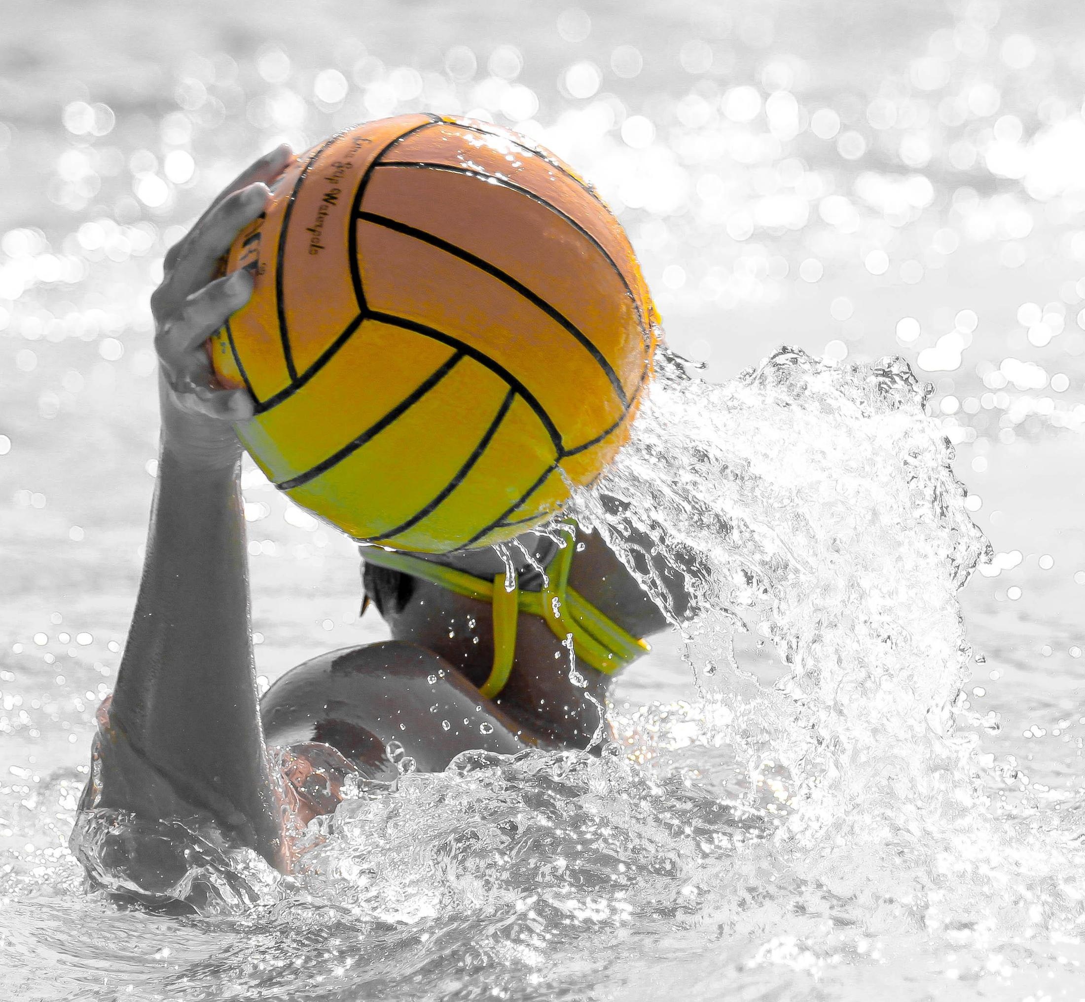 Water Polo: Monochrome poloist holding a standard ball during an event in Foothill High School. 2200x2030 HD Background.