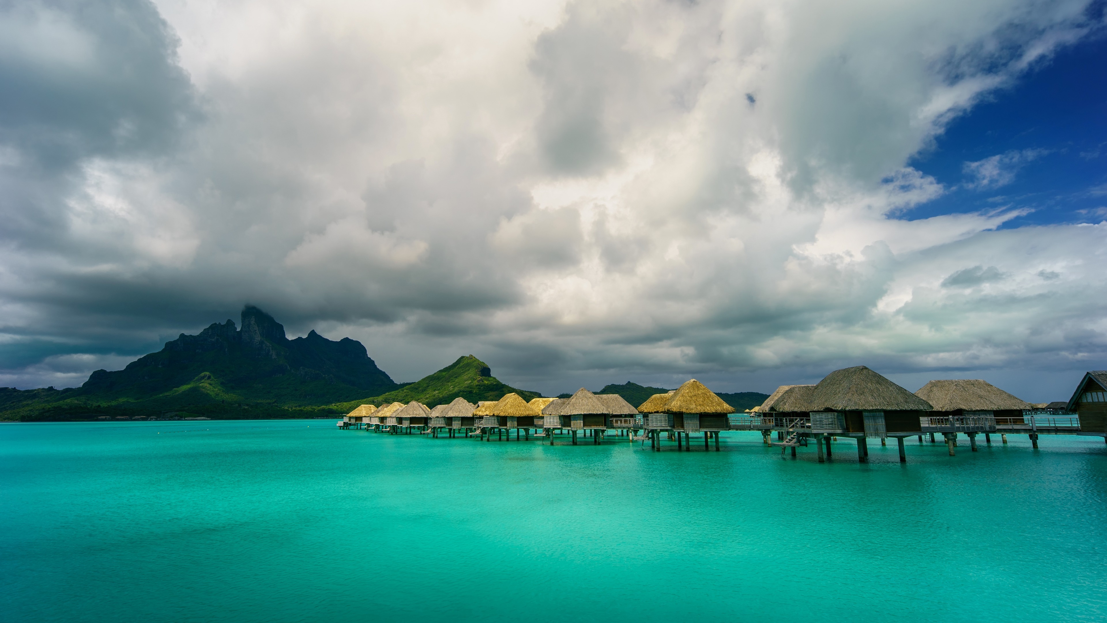 Bora Bora: World-famous for its vibrant turquoise lagoon, soft, white sandy stretches of beach and luxurious resorts. 3840x2160 4K Wallpaper.