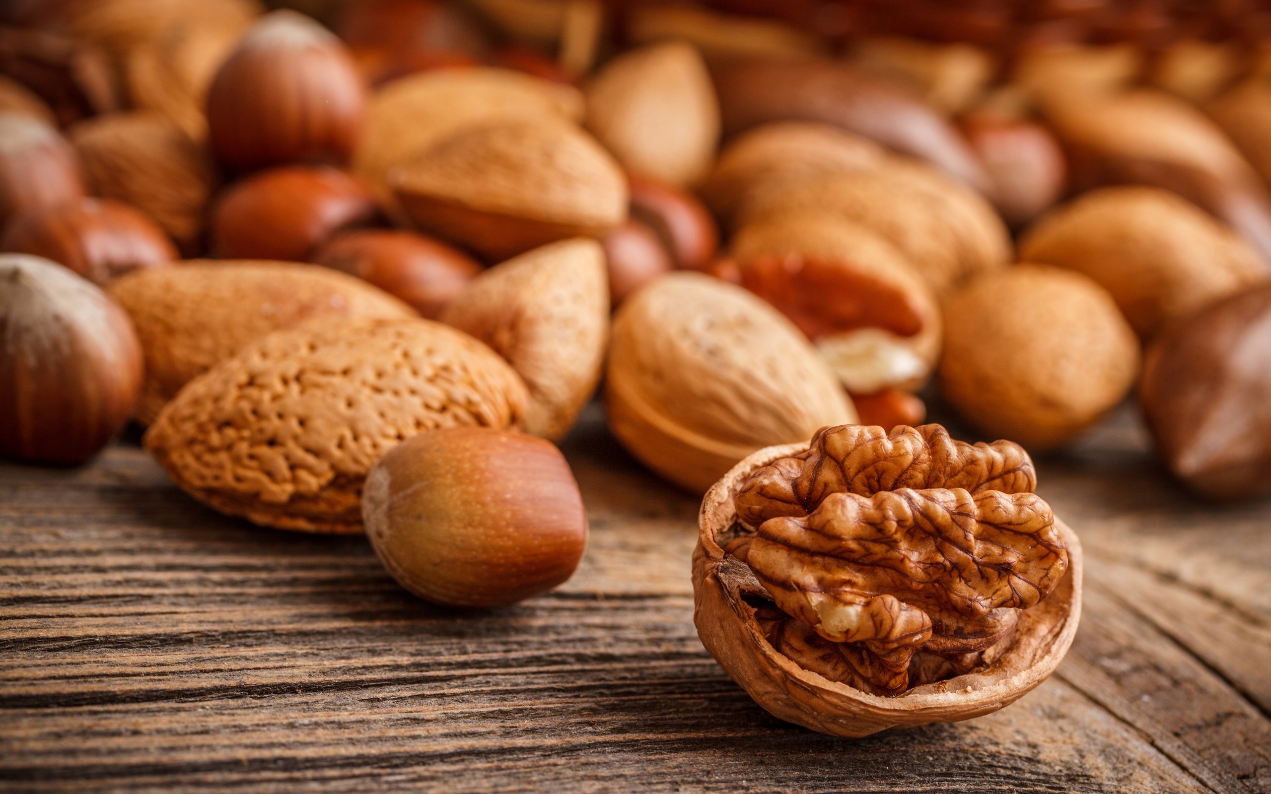 Nuts: Single-seeded stone fruits that grow from the walnut tree. 2560x1600 HD Background.