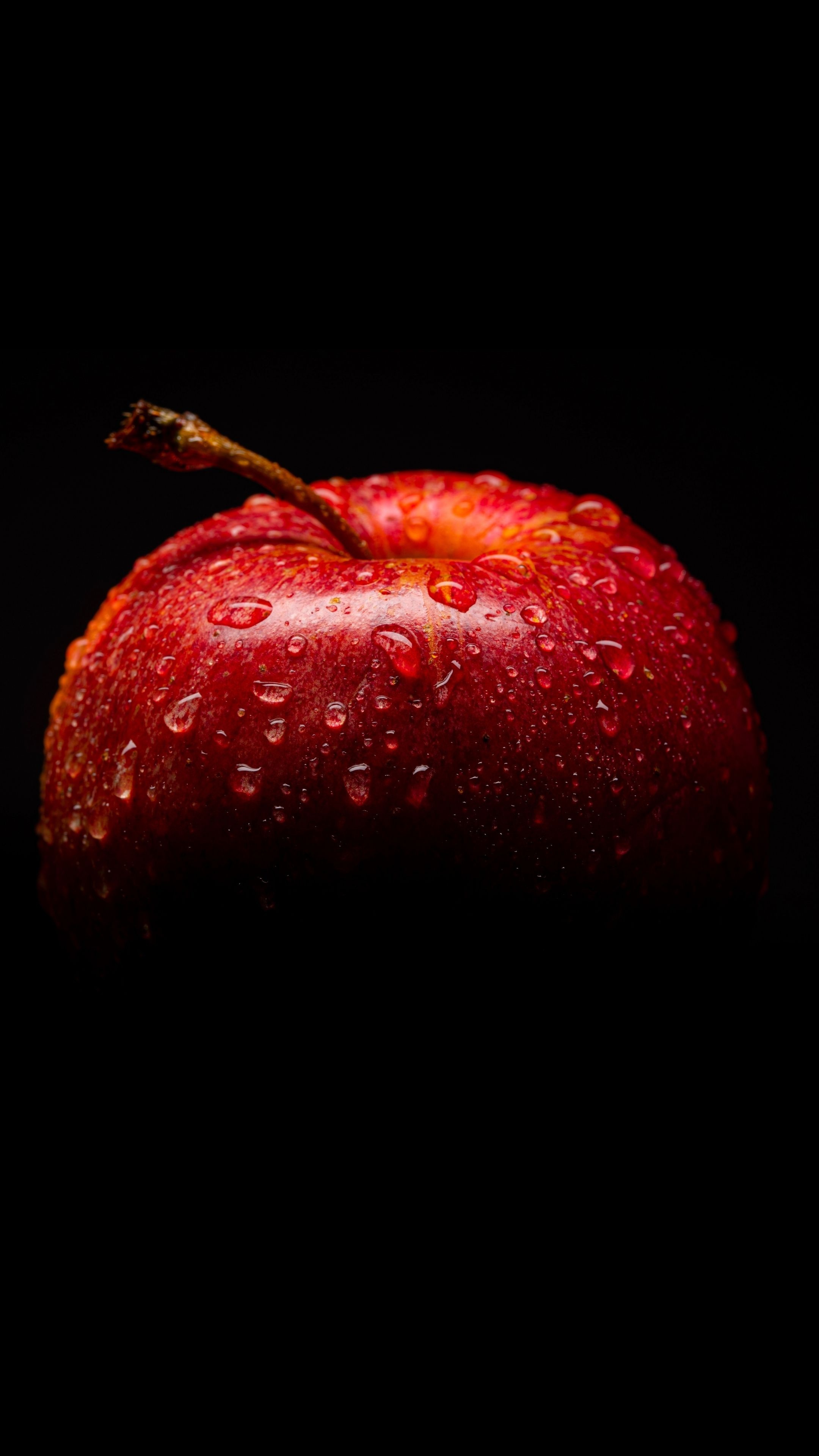 Apple (Fruit): A round, edible fruit produced by Malus domestica tree. 2160x3840 4K Background.