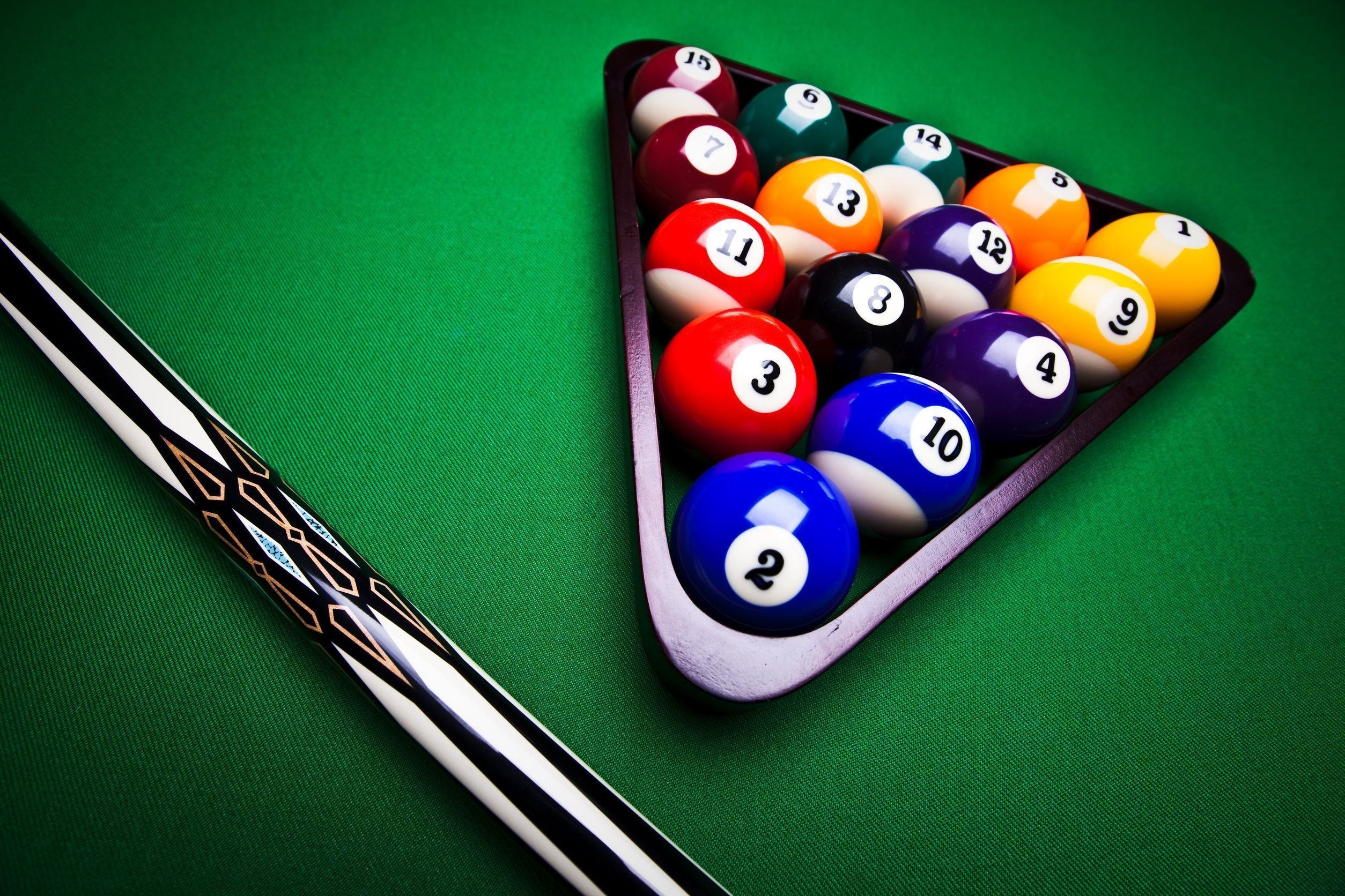 Billiards: Two cue sticks, Fifteen object balls in a rack, Eight-ball style recreational game, Billiard triangle, Pool stick. 2510x1680 HD Background.