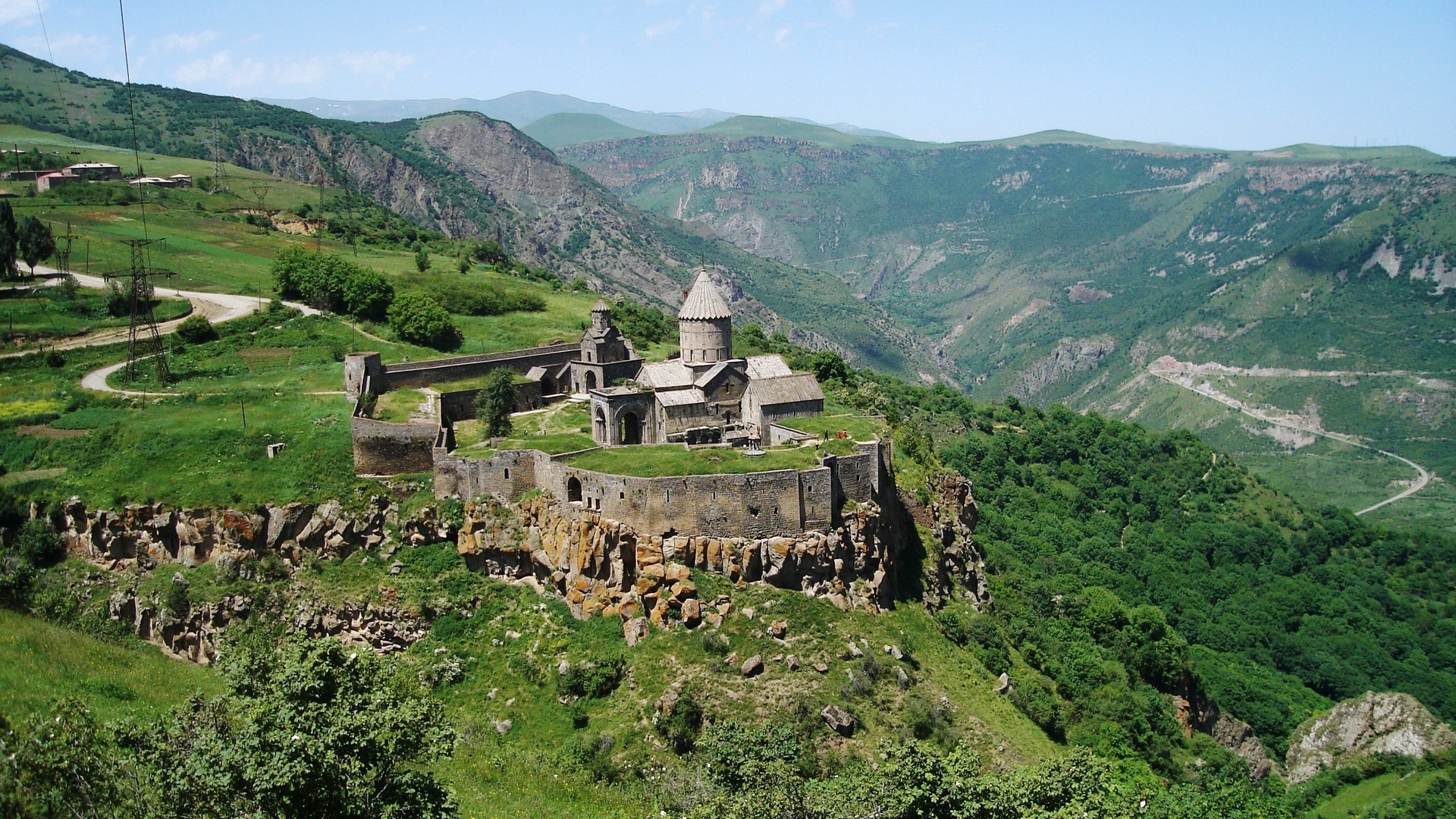 Armenia: The monastic ensemble standing on the edge of a deep gorge of the Vorotan River. 1920x1080 Full HD Background.