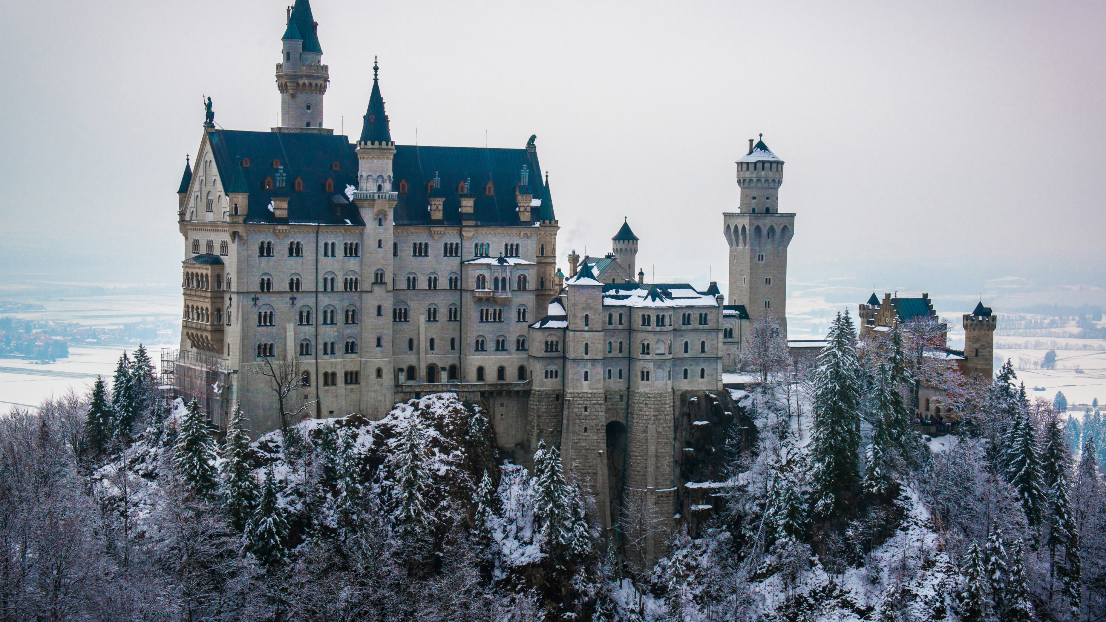 Neuschwanstein Castle: A palace built atop a rock ledge over the Pollat Gorge, Germany. 3840x2160 4K Background.