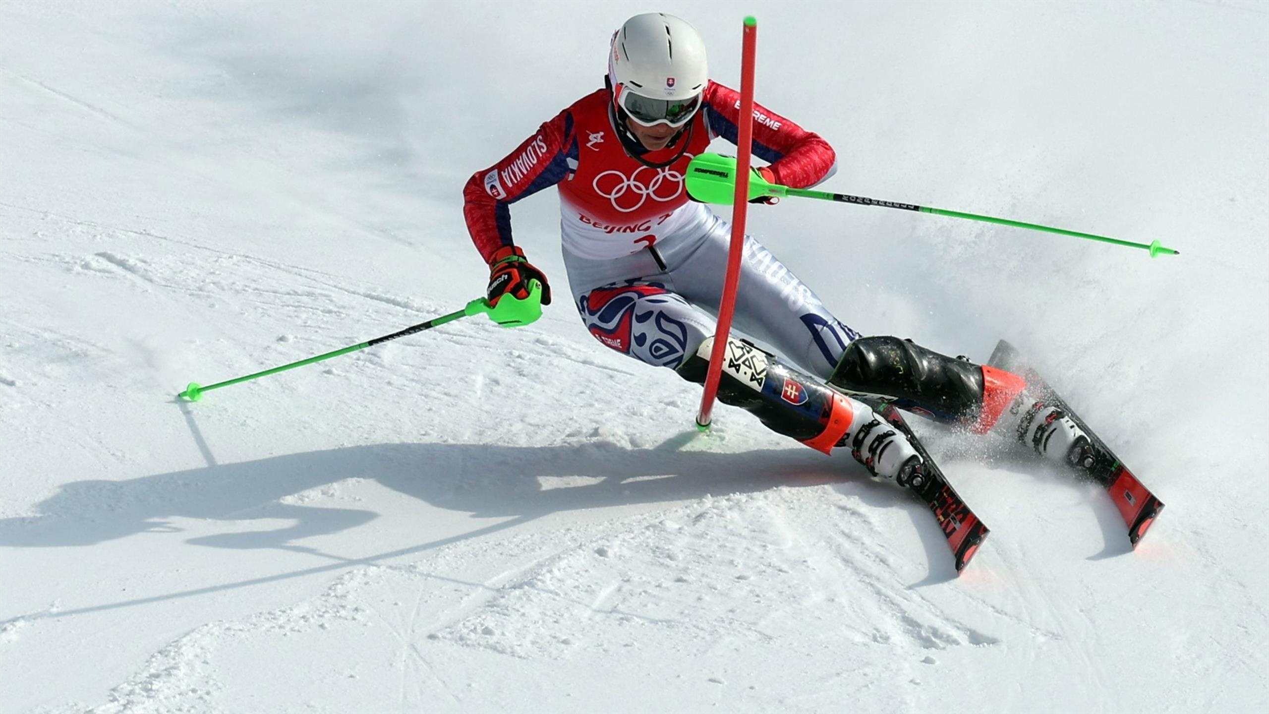 Slalom: Petra Vlhova, Beijing 2022 Winter Olympics, Skiing in a zigzag between upright obstacles. 2560x1440 HD Wallpaper.