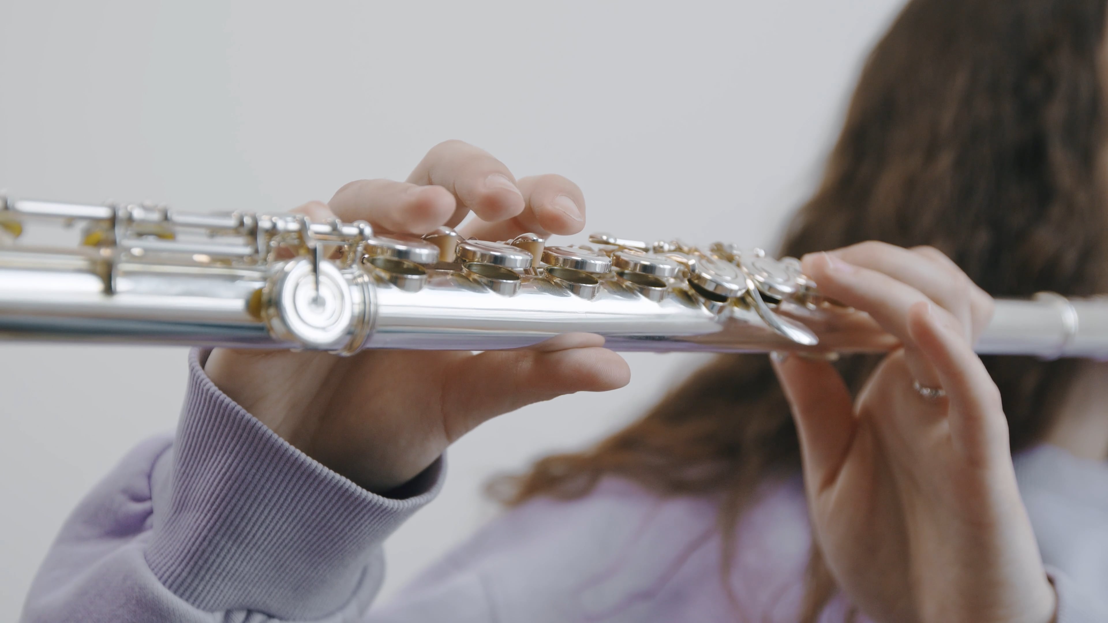Flute: A woman playing music, A classical music instrument of the woodwind group. 3840x2160 4K Background.
