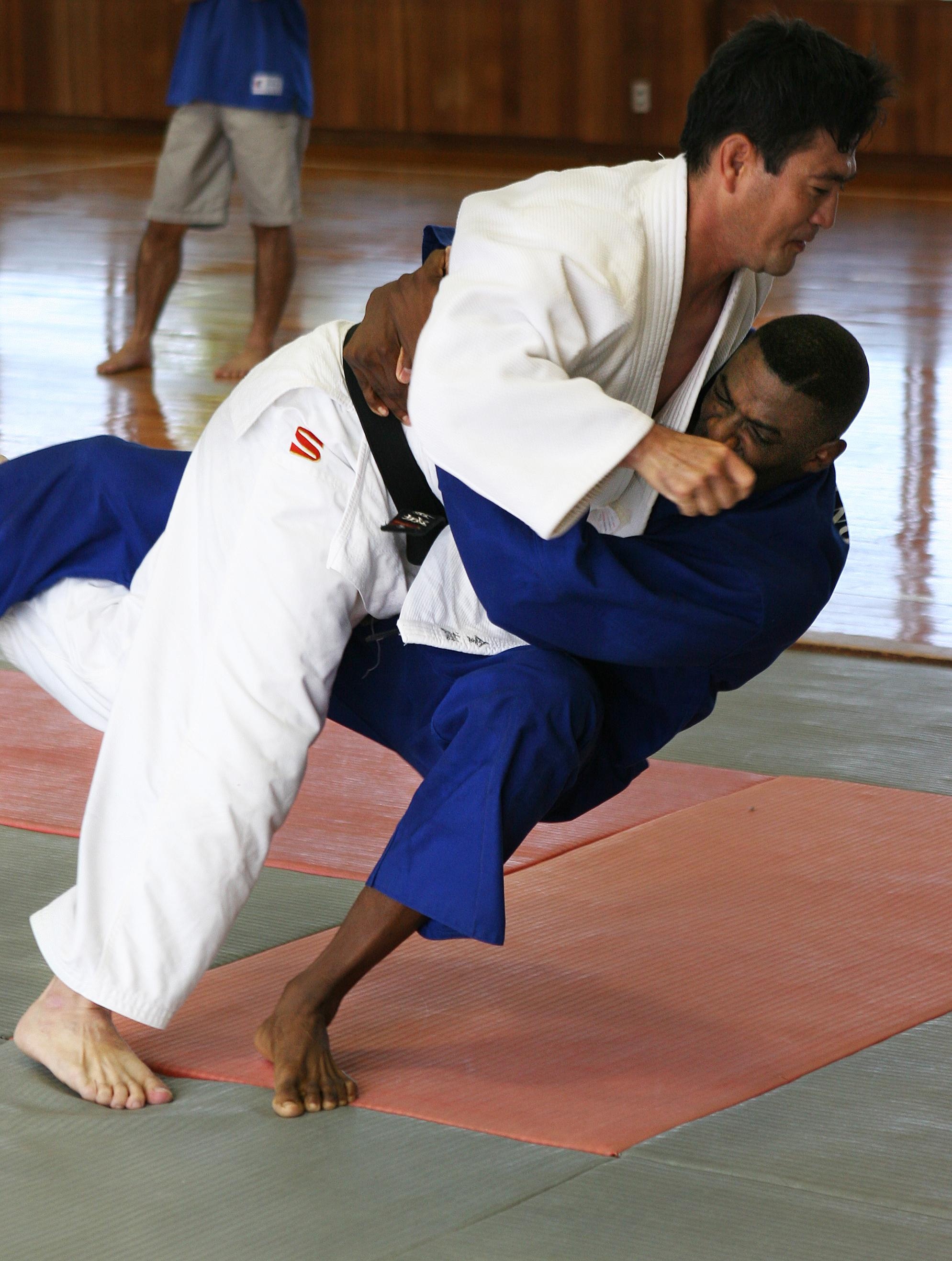 Judo: Ouchi-gari movement, The tachi-waza and the ne-waza throwing techniques. 1990x2640 HD Background.