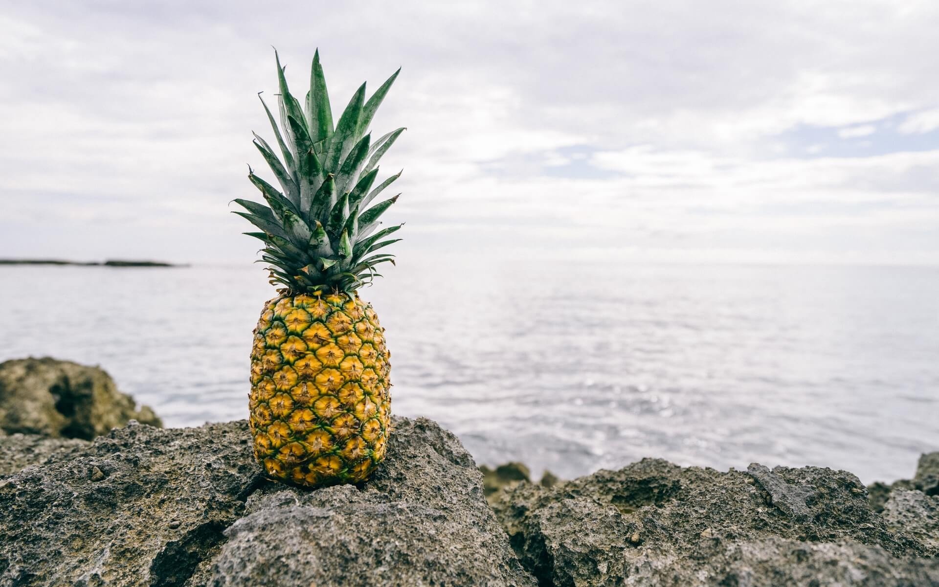 Pineapple: A large tropical fruit with a spiky, tough skin and sweet insides. 1920x1200 HD Background.