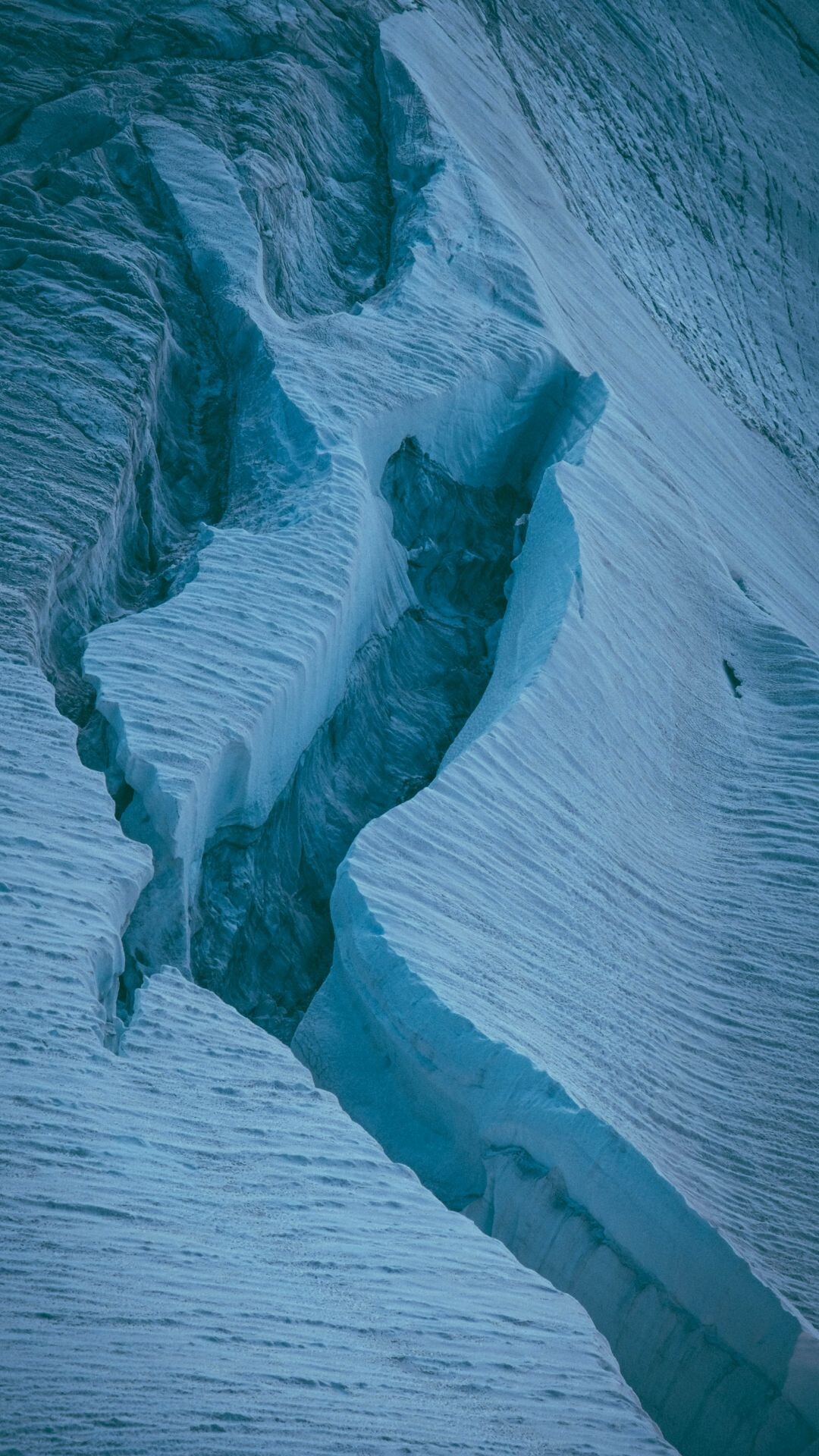 Glacier: A slowly moving mass of ice originating from an accumulation of snow. 1080x1920 Full HD Background.