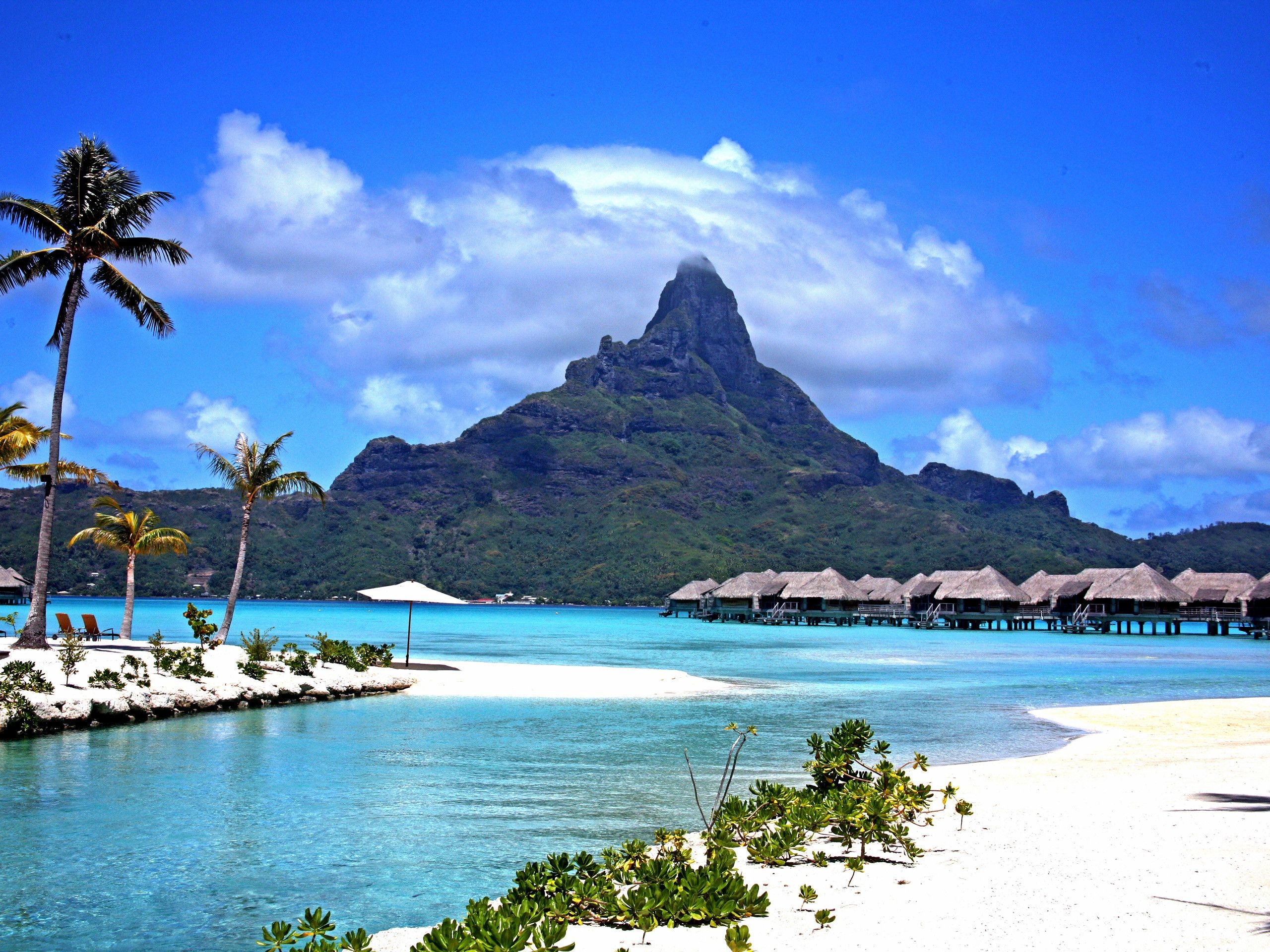 Bora Bora: In the center of the island are the remnants of an extinct volcano, rising to two peaks, Mount Pahia and Mount Otemanu. 2560x1920 HD Wallpaper.