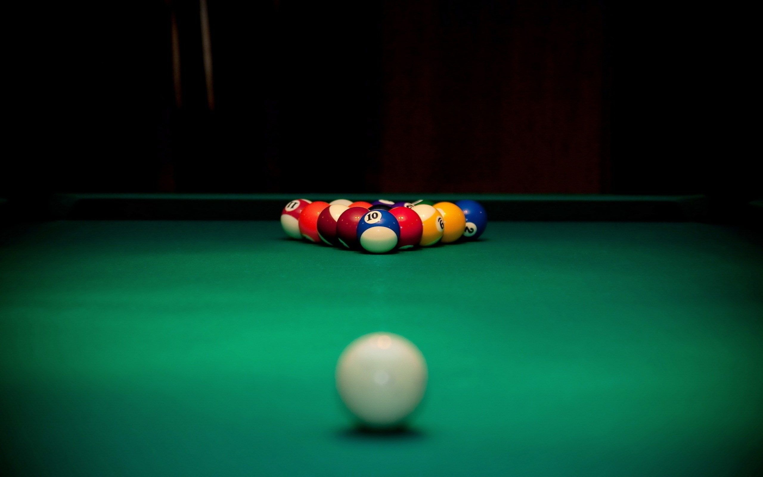 Cue Sports: A white cue ball before the break shot in a classic eightball type of a recreational sport. 2560x1600 HD Wallpaper.