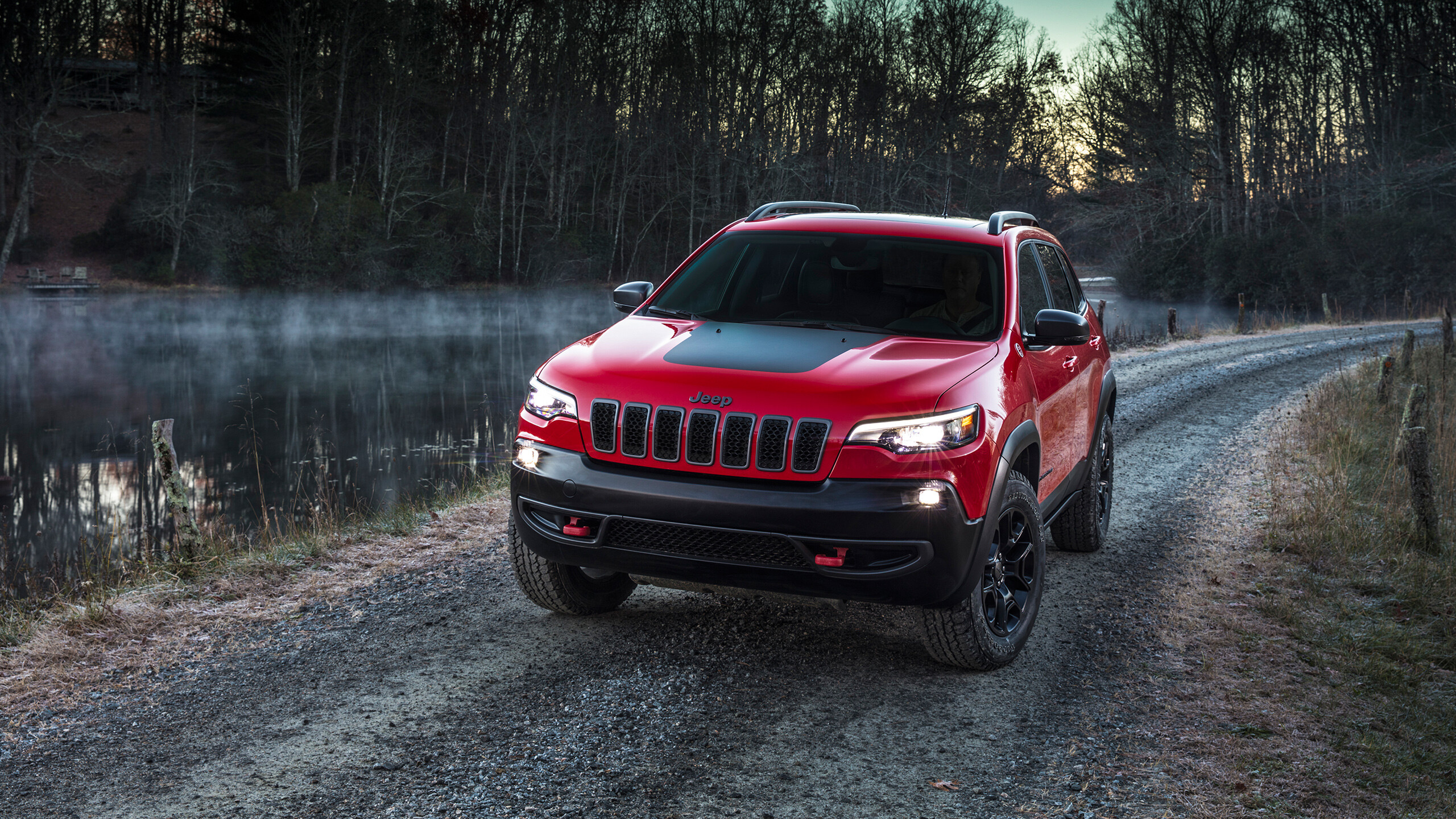Jeep Grand Cherokee: American SUV, Combines off-road capability with on-road comfort. 2560x1440 HD Background.