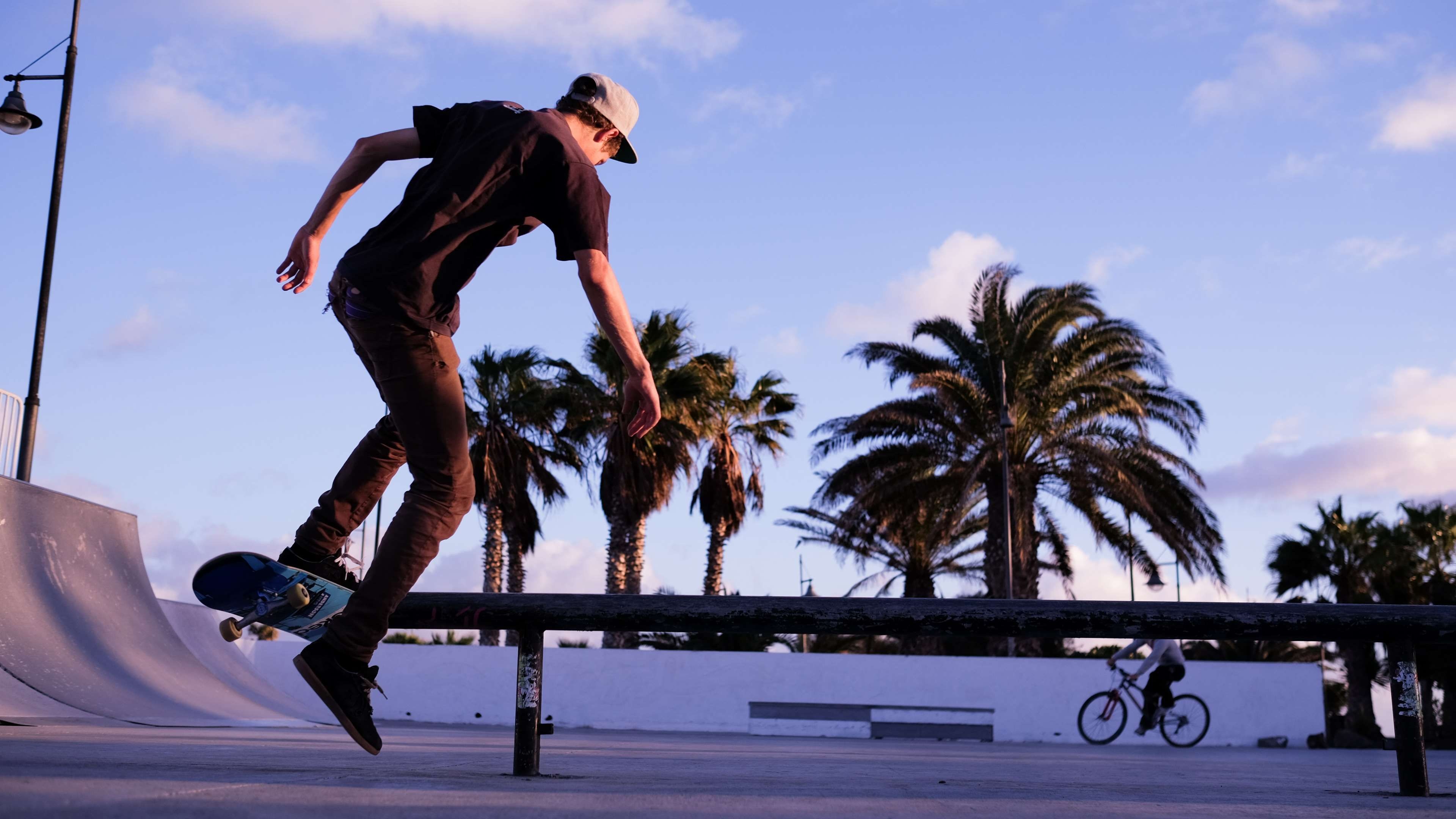 Skateboarding: Skater doing a kickflip in a ramp skating park, Street sport. 3840x2160 4K Background.