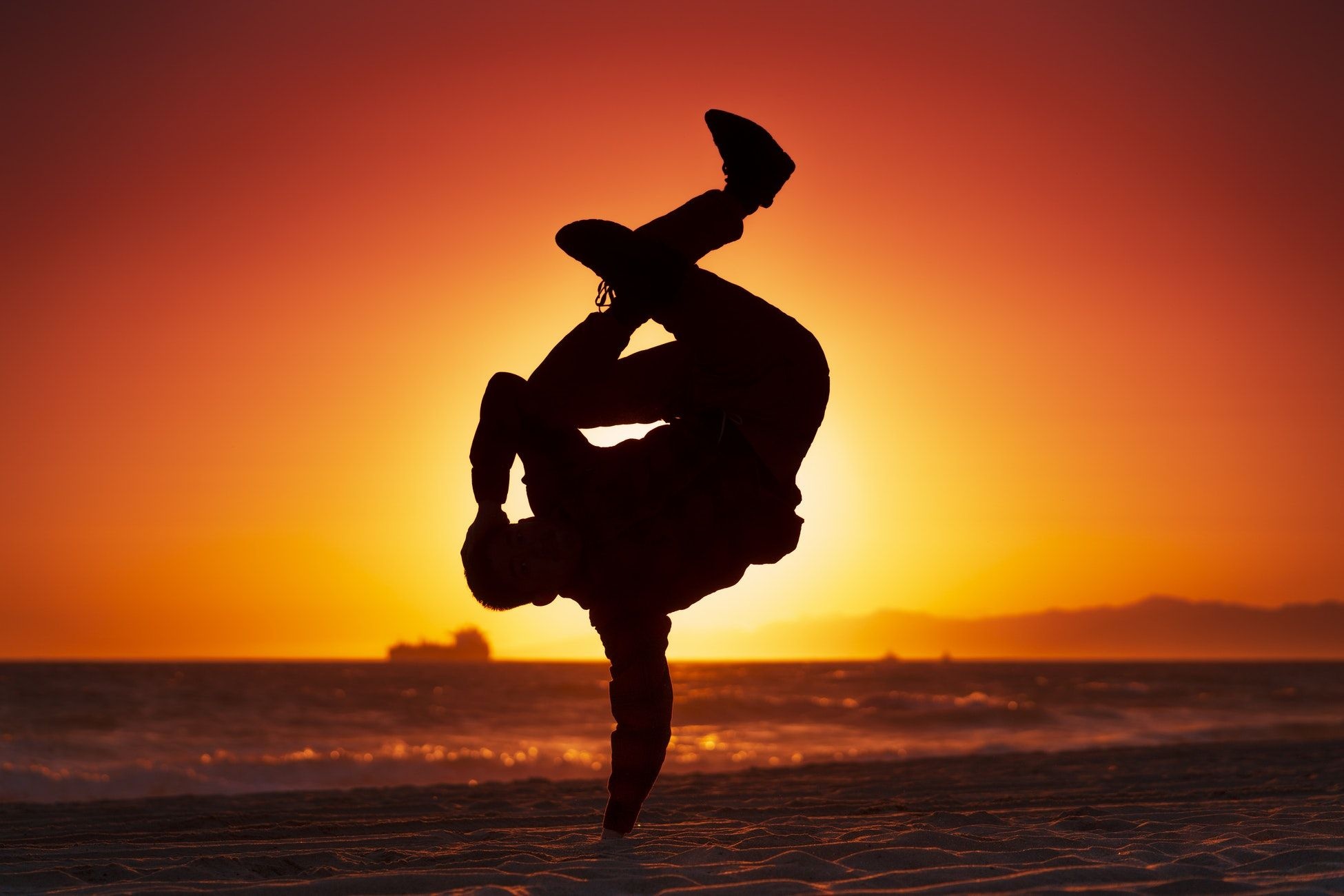 Breakdancing: Balance-intensive freezing technique, B-boying, Athletic dance, Breakdance choreography. 1950x1300 HD Wallpaper.