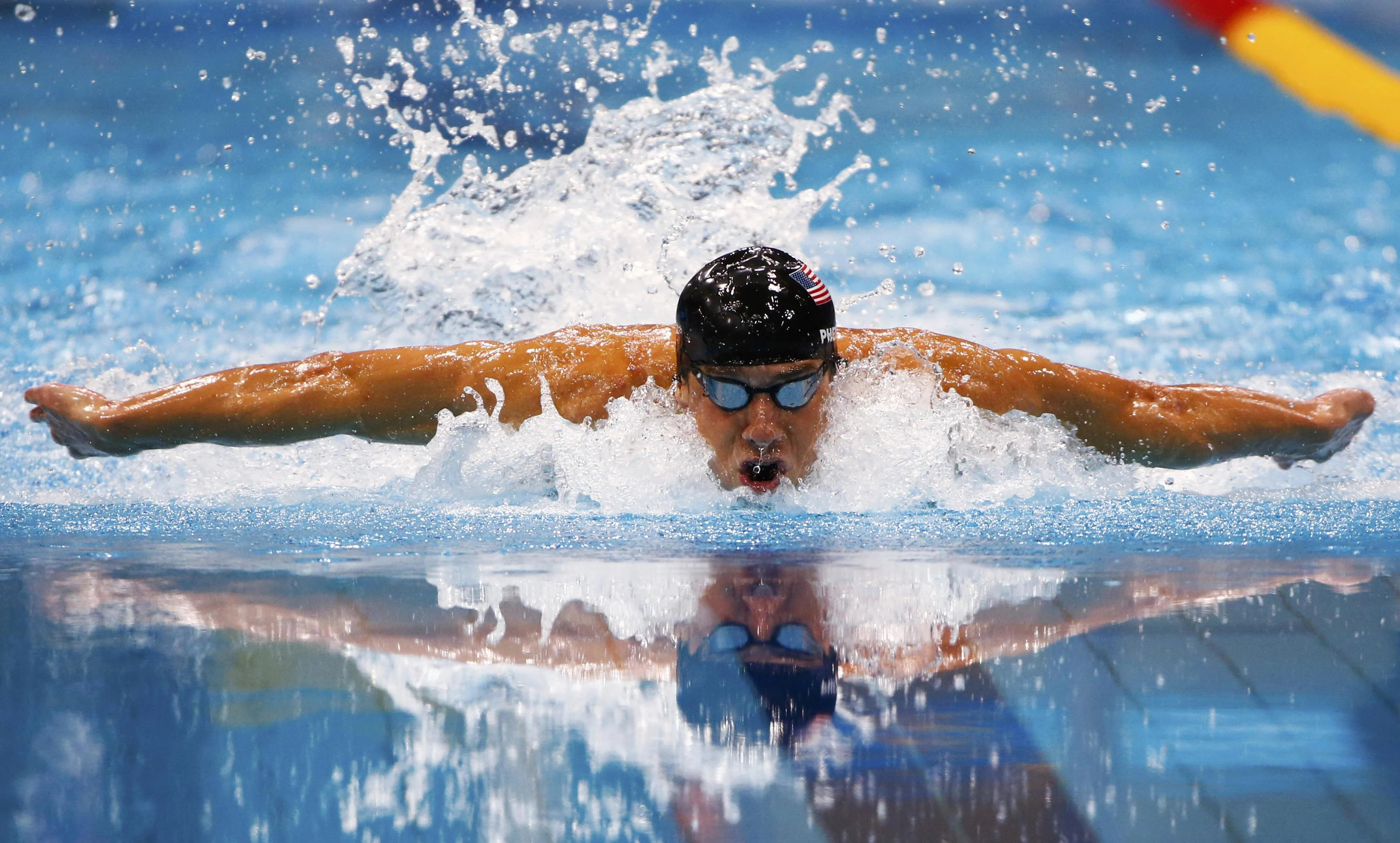Swimming: An American professional butterfly stroke swimmer, Competitive water sports. 3500x2110 HD Background.