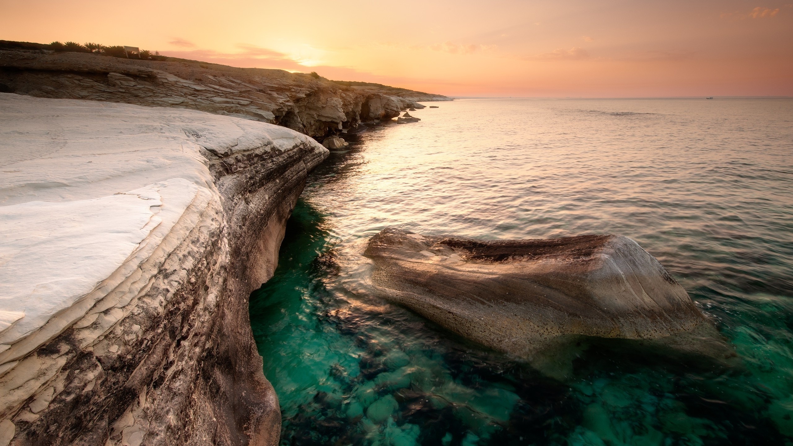 Cyprus coast sea, Rock and sunset, Beach view, Serene atmosphere, 2560x1440 HD Desktop