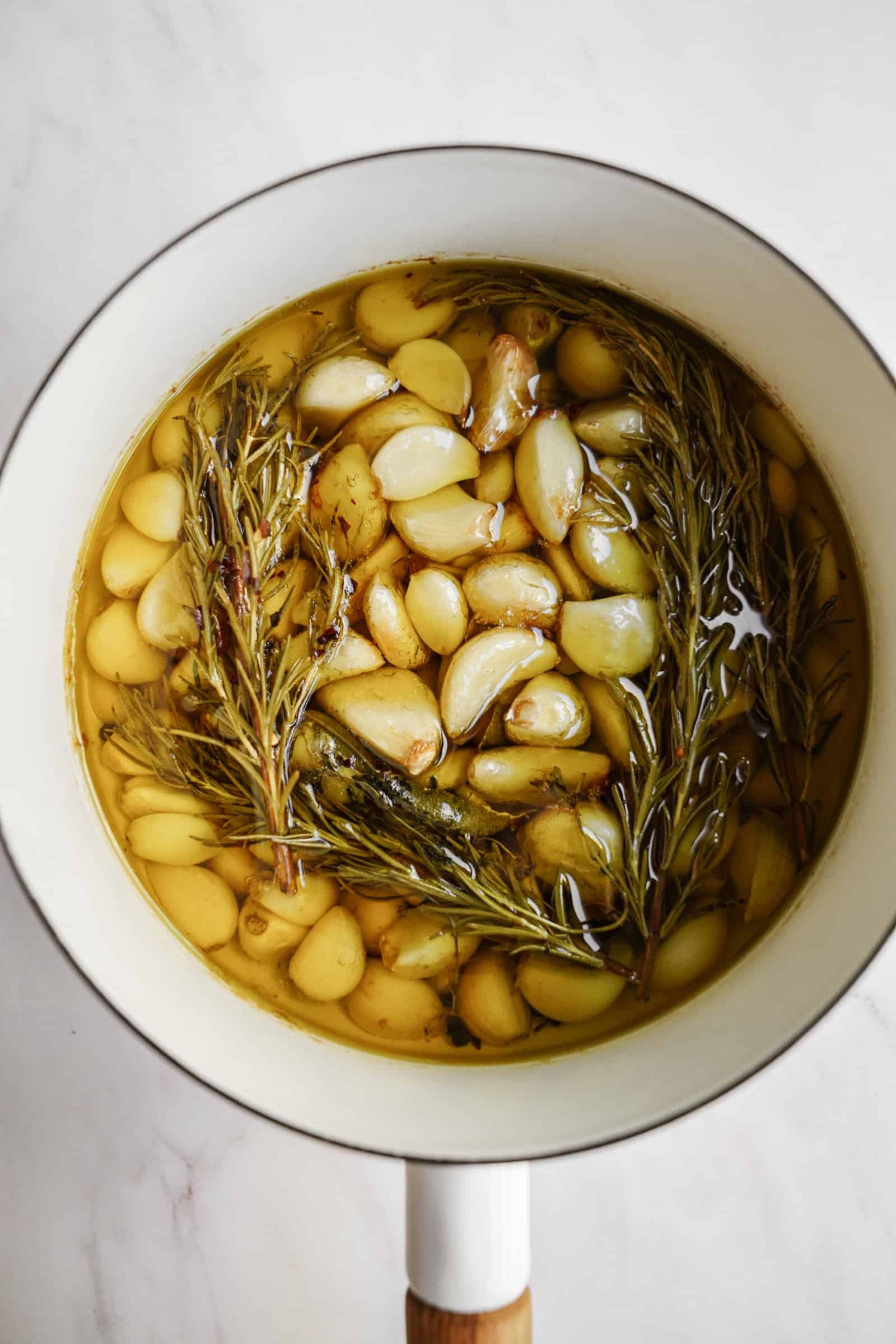 Garlic confit recipe, Flavorful dish, FoodByMaria creation, Cooking technique, 1600x2400 HD Phone