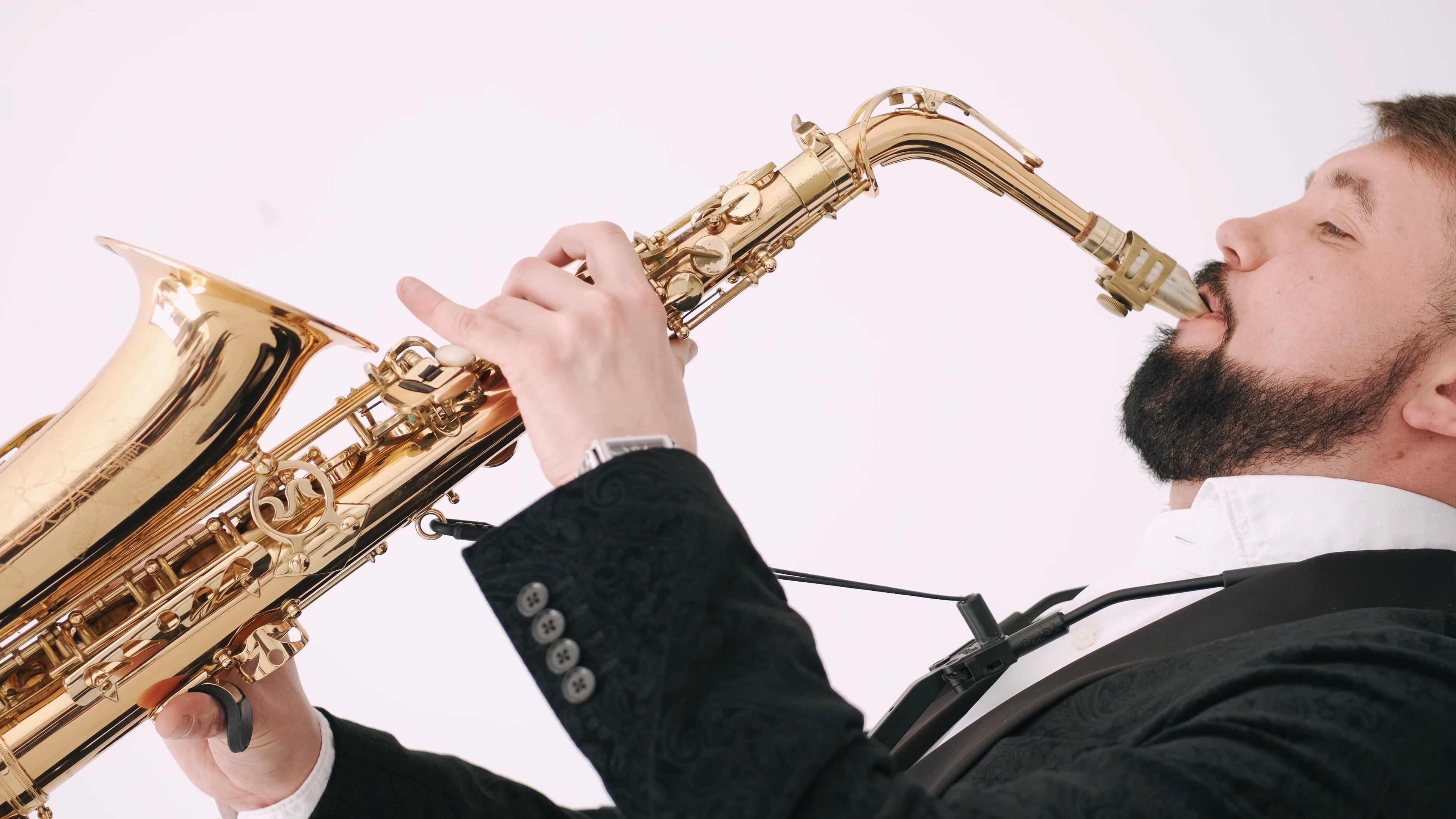 Saxophone: Man playing music, A type of single-reed woodwind instrument with a conical body. 3840x2160 4K Background.
