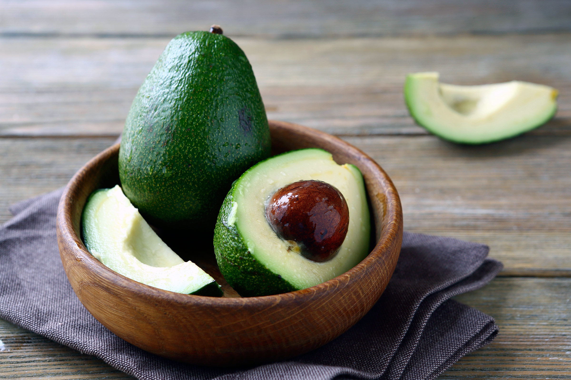 Avocado: A climacteric fruit, which matures on the tree but ripens off the tree. 2400x1600 HD Background.