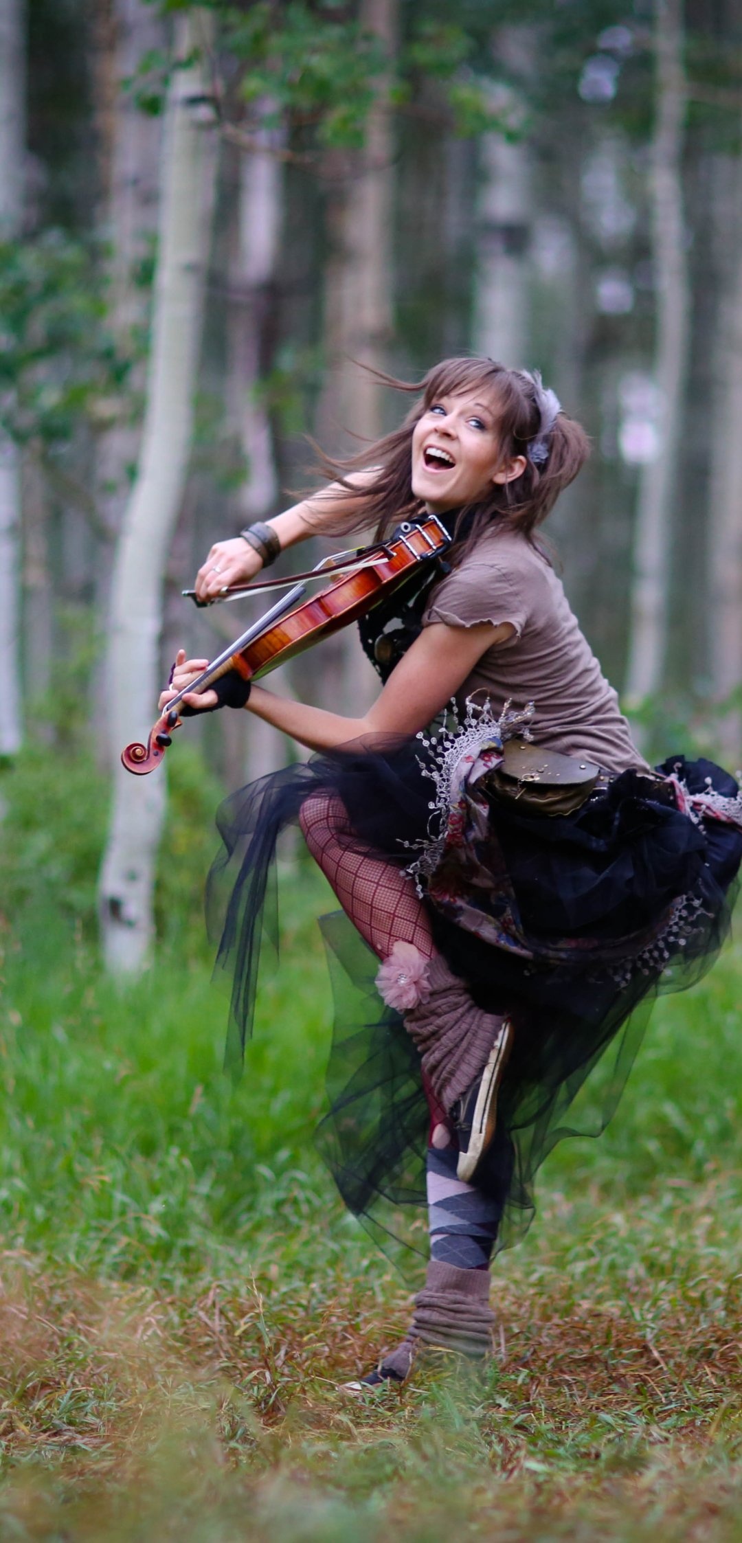 Lindsey Stirling, Talented musician, Energetic performances, Unique style, 1080x2250 HD Phone